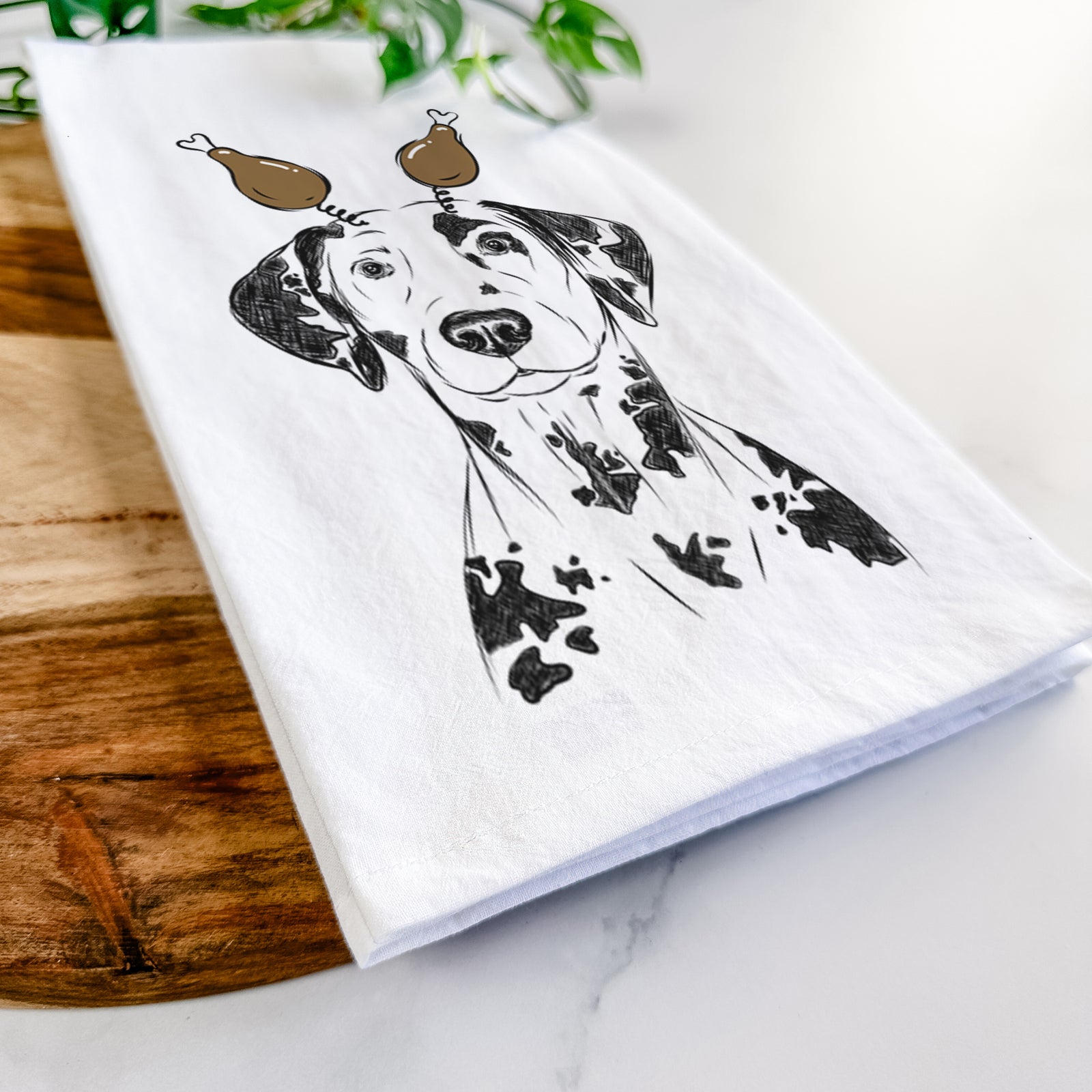 Hand-drawn sketch of Spot the Dalmatian with a Thanksgiving turkey headpiece on a tea towel