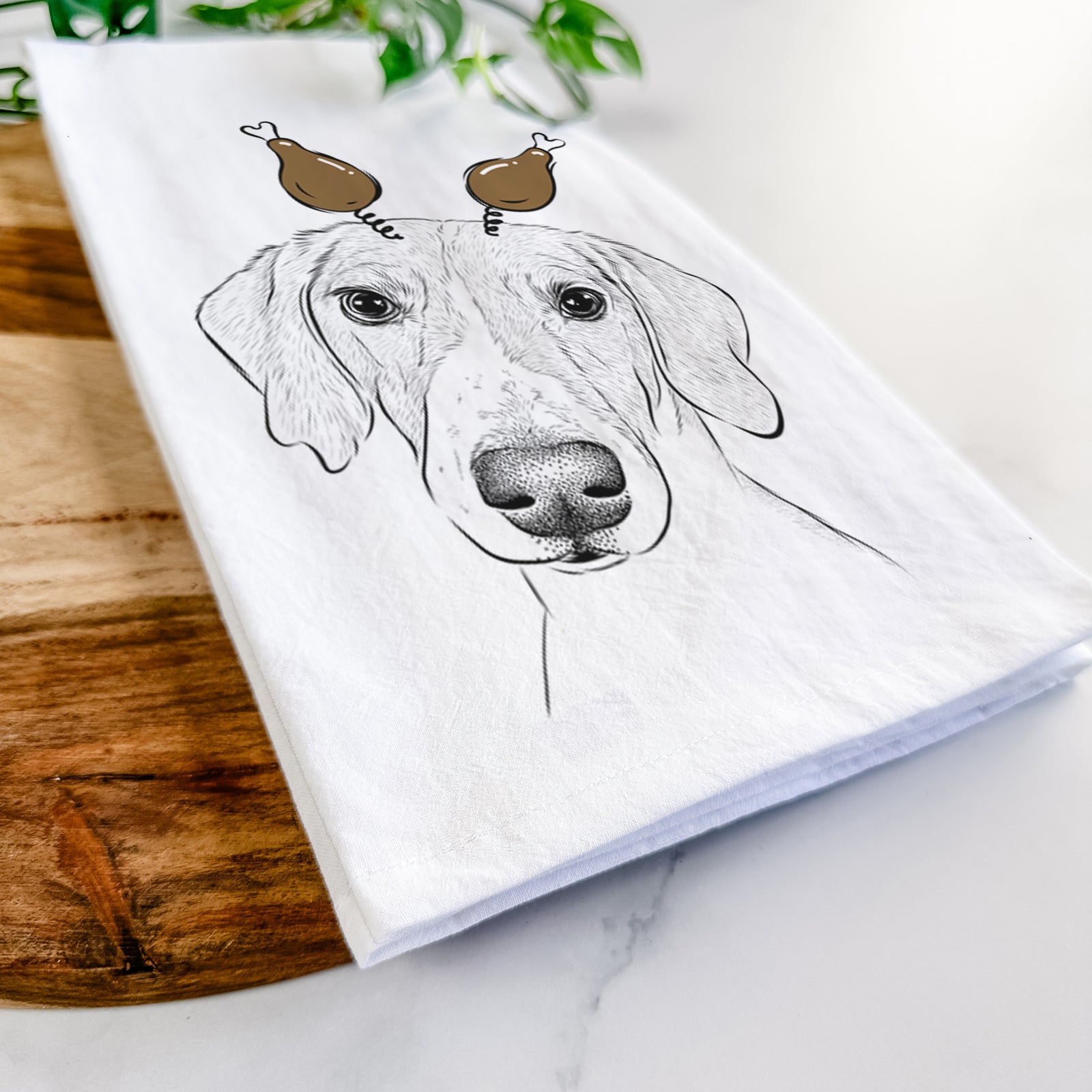 Hand-drawn sketch of Stanley the Foxhound with a Thanksgiving turkey headpiece on a tea towel