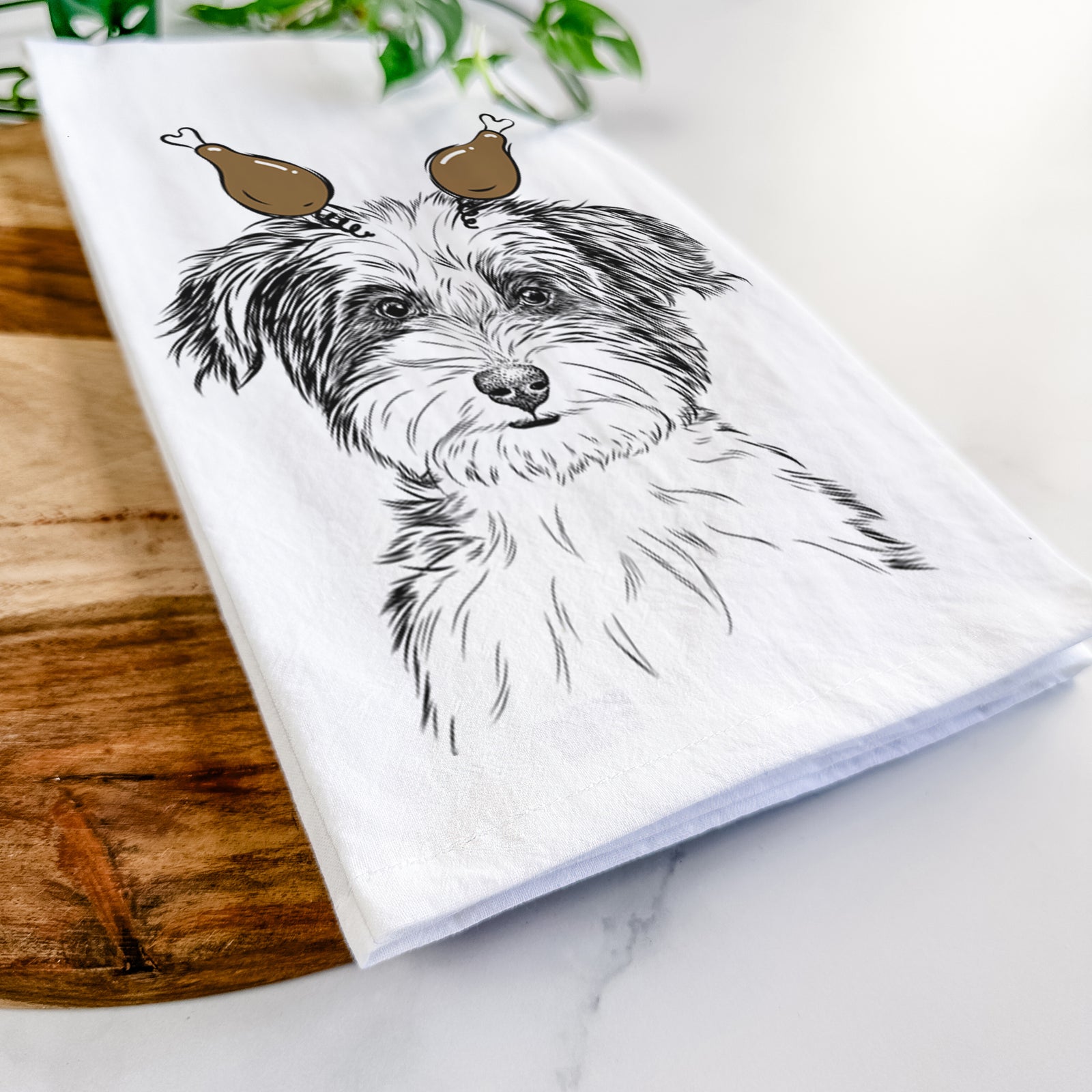 Hand-drawn sketch of Teddy the Havanese with a Thanksgiving turkey headpiece on a tea towel