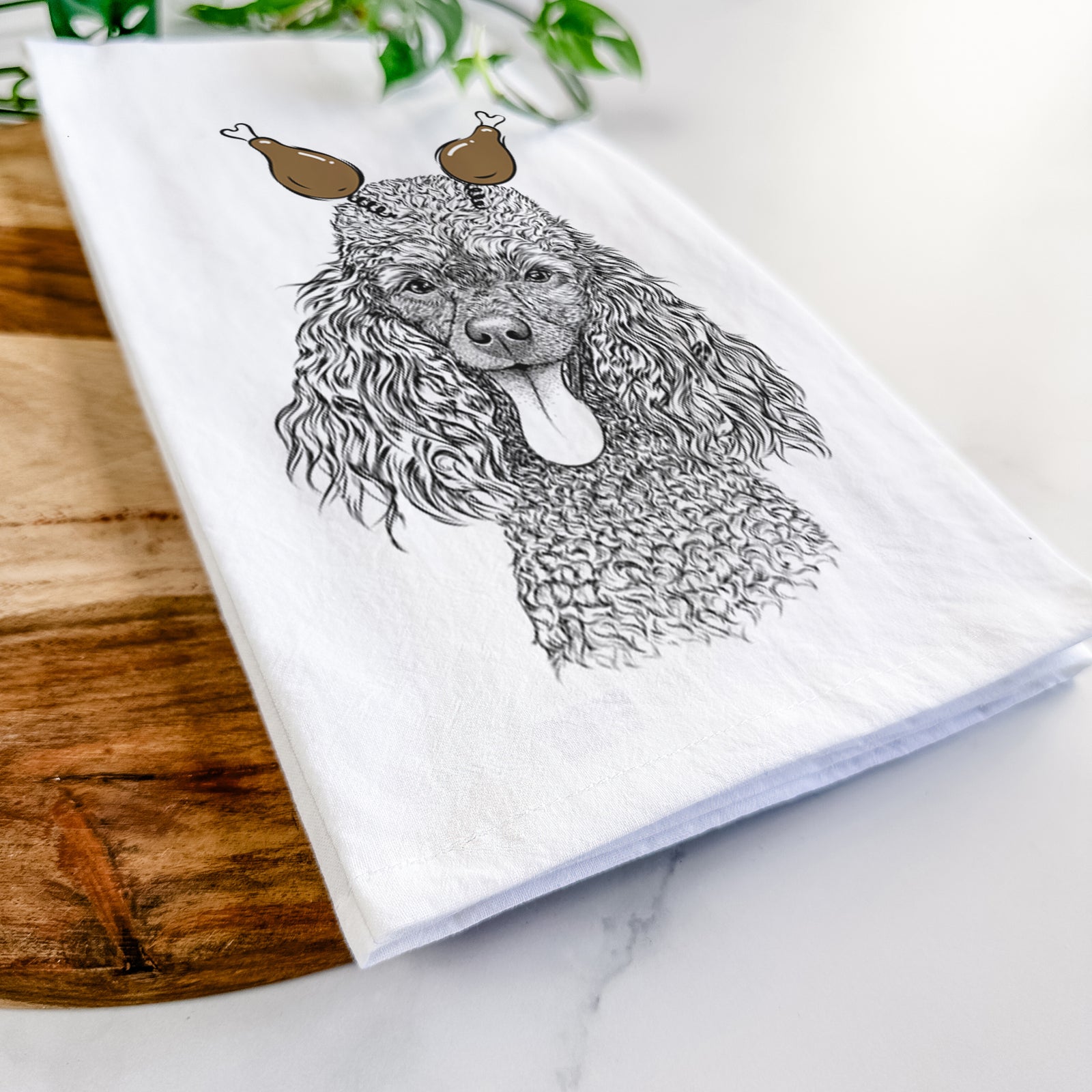 Hand-drawn sketch of Teddy the Mini Poodle with a Thanksgiving turkey headpiece on a tea towel