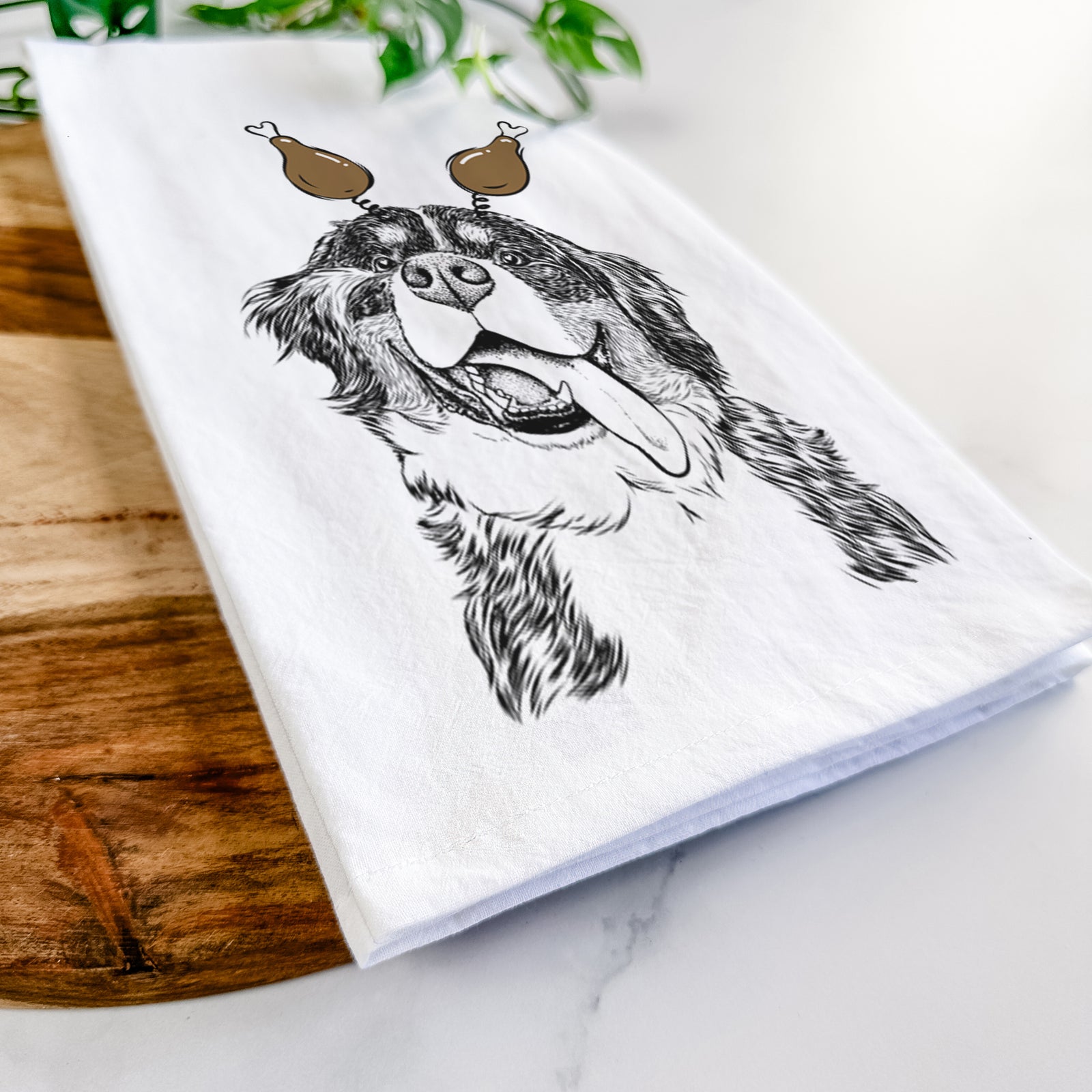 Hand-drawn sketch of Theo the Bernese Mountain Dog with a Thanksgiving turkey headpiece on a tea towel