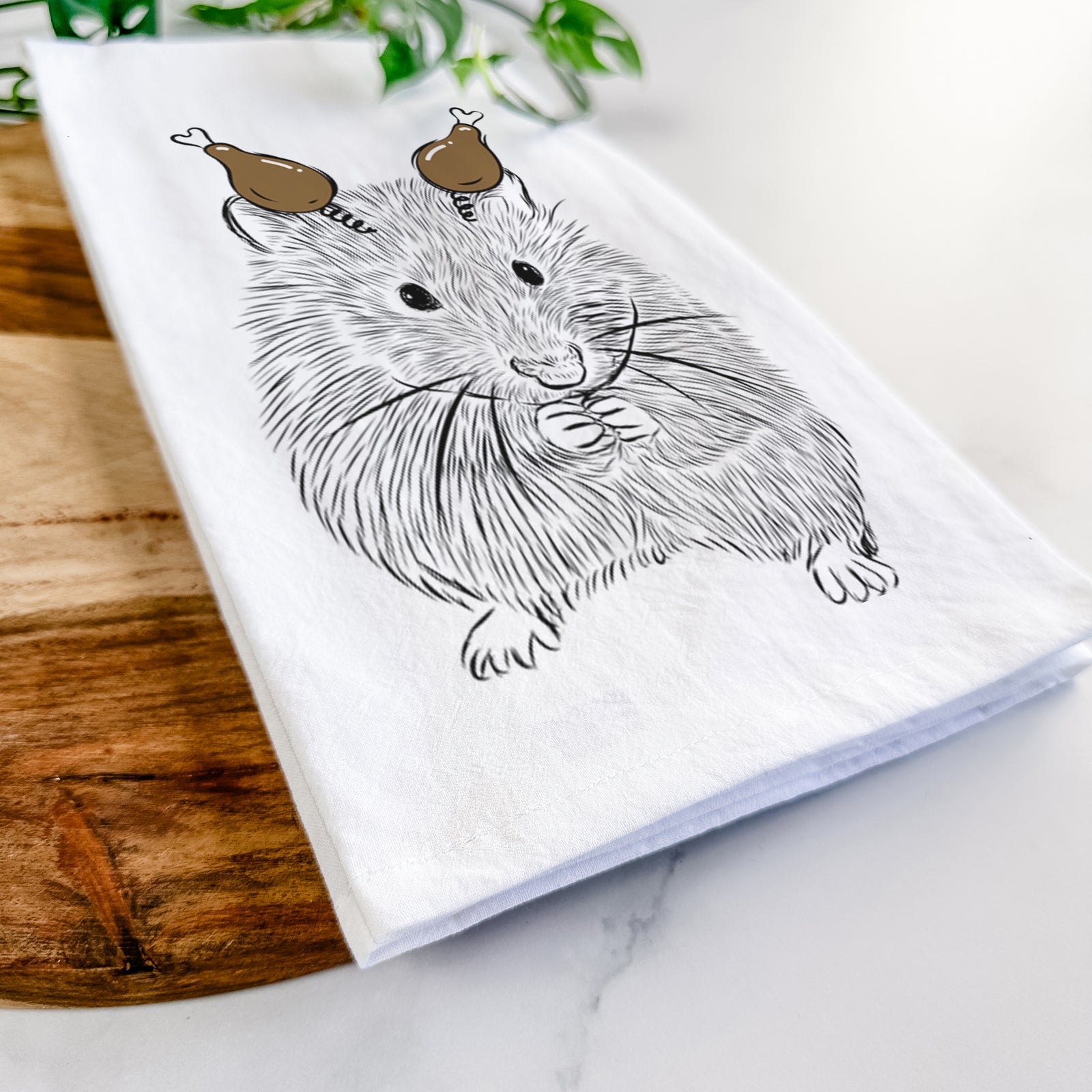 Hand-drawn sketch of Twitch the Hamster with a Thanksgiving turkey headpiece on a tea towel