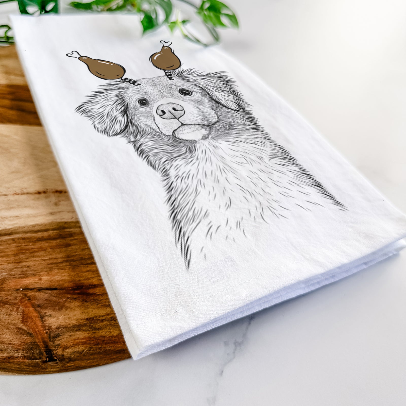 Hand-drawn sketch of Vixen the Nova Scotia Duck Tolling Retriever with a Thanksgiving turkey headpiece on a tea towel