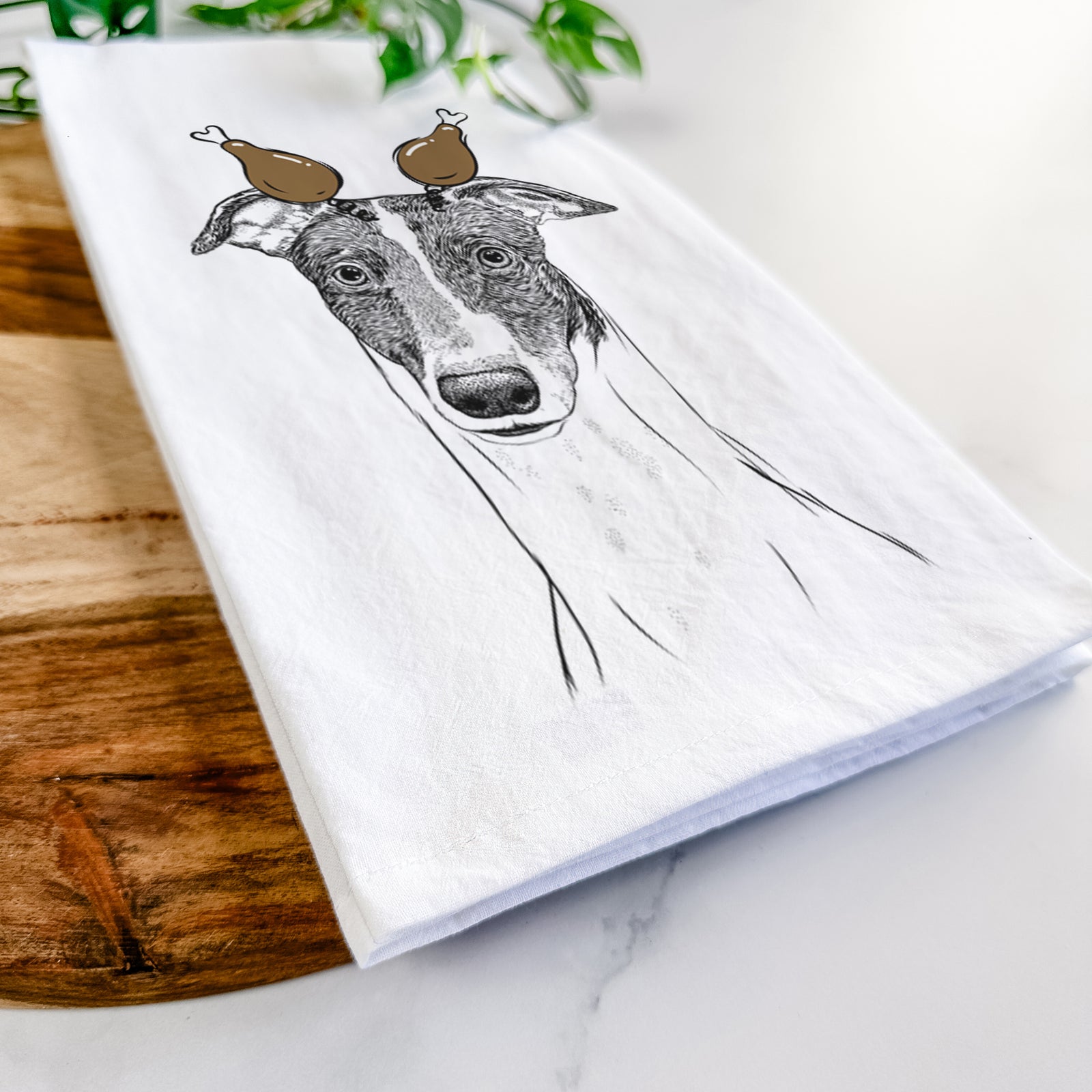 Hand-drawn sketch of Vyncent the Greyhound with a Thanksgiving turkey headpiece on a tea towel