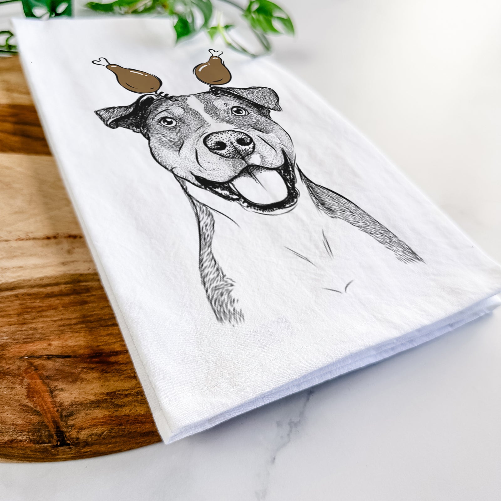Hand-drawn sketch of Wendy the Mixed Breed with a Thanksgiving turkey headpiece on a tea towel