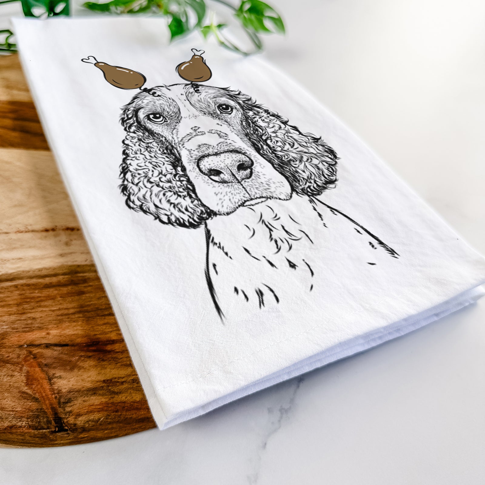 Hand-drawn sketch of Wilbur the English Springer Spaniel with a Thanksgiving turkey headpiece on a tea towel