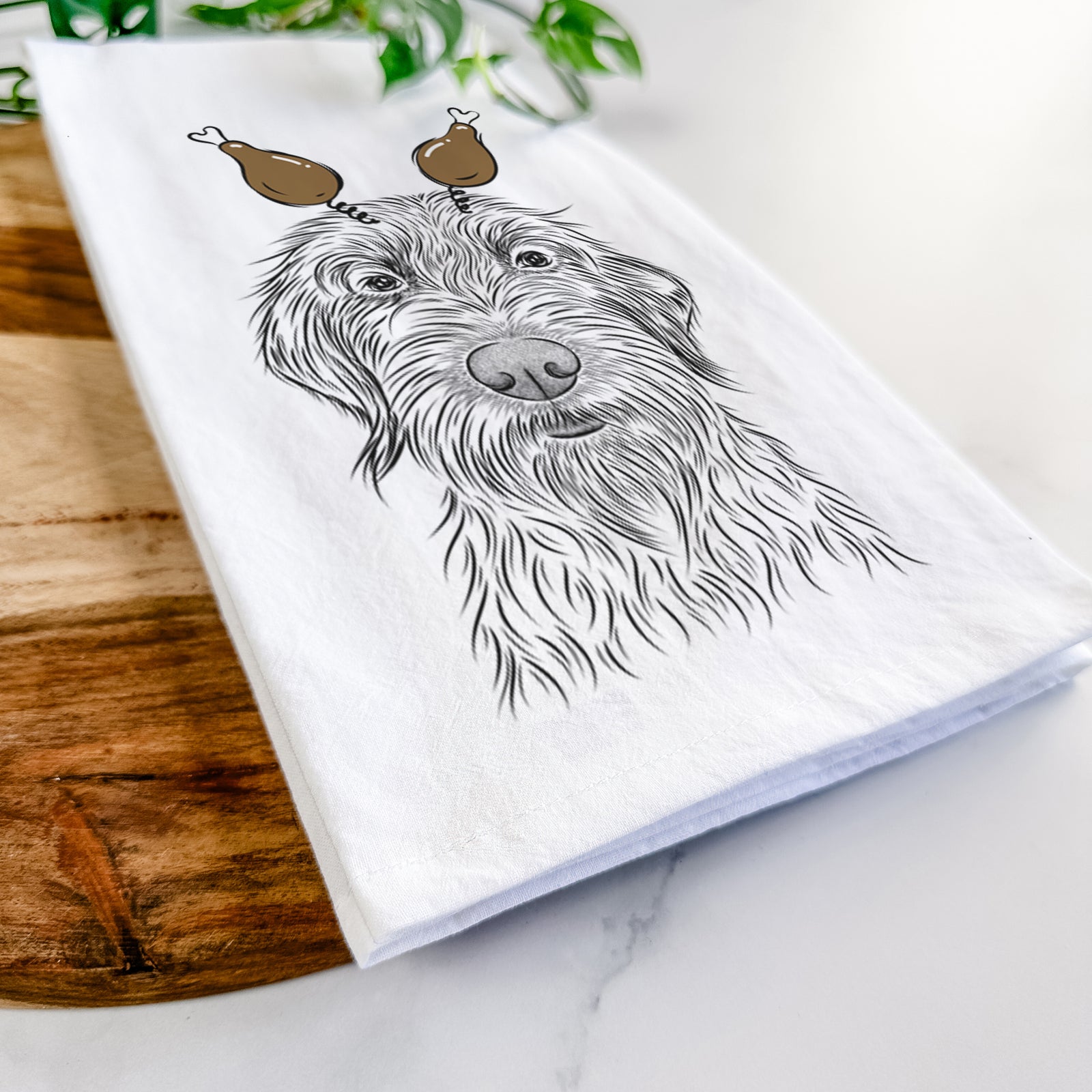 Hand-drawn sketch of Wilkins the Wirehaired Pointing Griffon with a Thanksgiving turkey headpiece on a tea towel