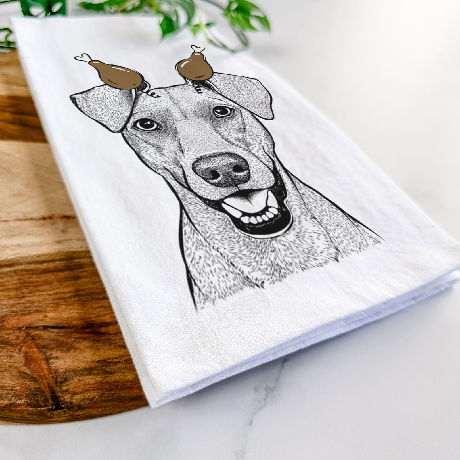 Hand-drawn sketch of Willow the German Pinscher with a Thanksgiving turkey headpiece on a tea towel