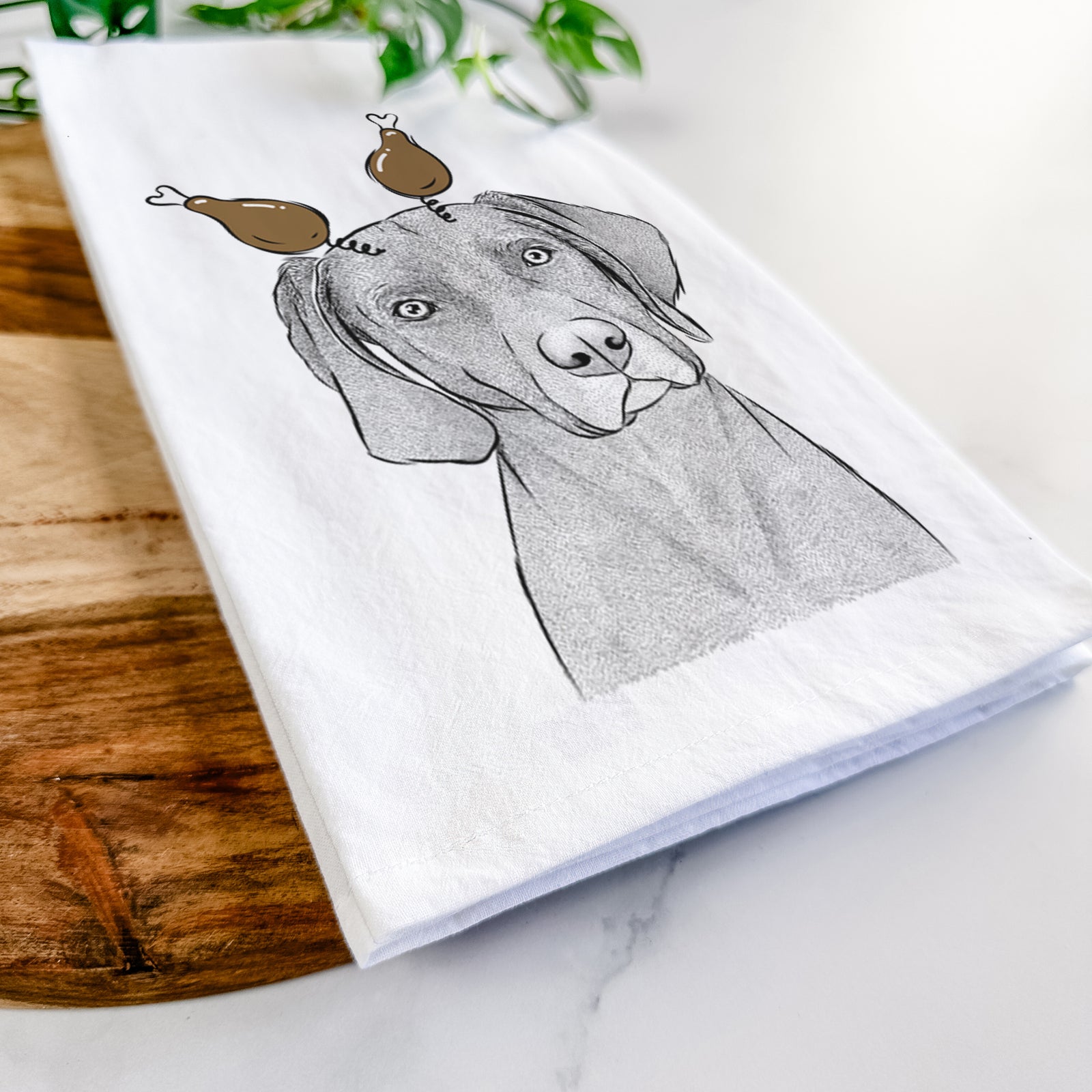 Hand-drawn sketch of Willow the Weizsla with a Thanksgiving turkey headpiece on a tea towel