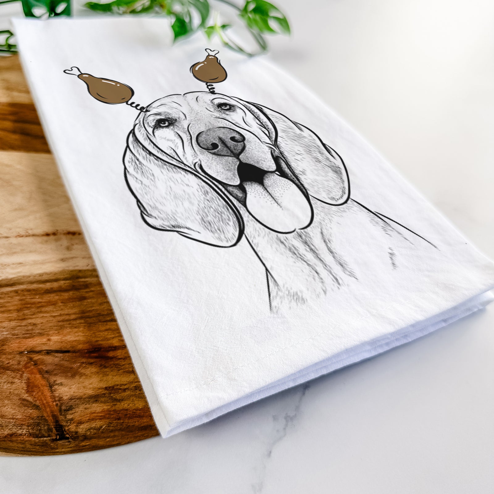 Hand-drawn sketch of Winston the Redbone Coonhound with a Thanksgiving turkey headpiece on a tea towel