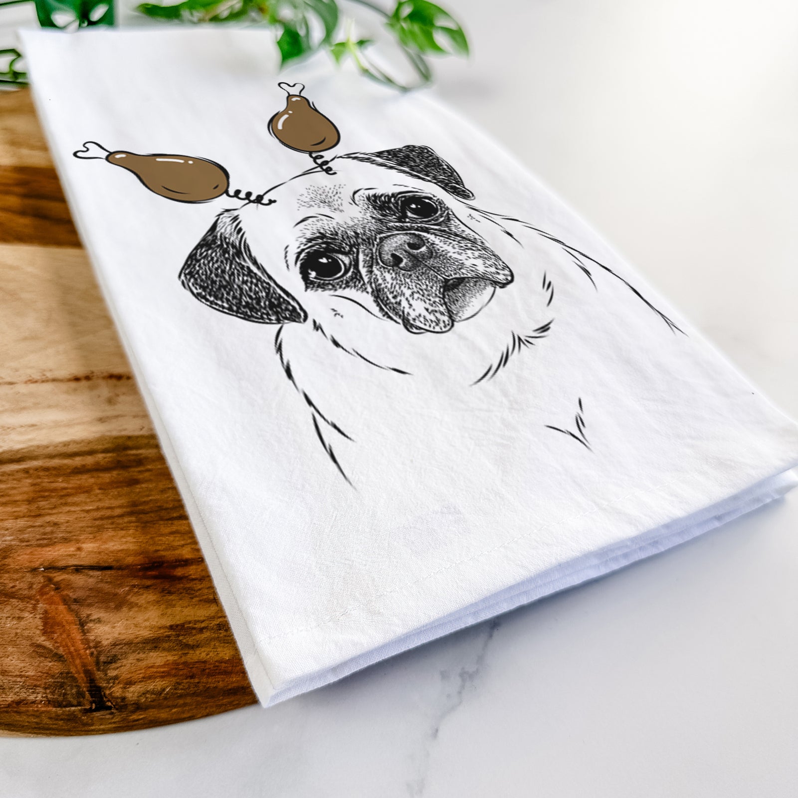 Hand-drawn sketch of Zoey the Pug with a Thanksgiving turkey headpiece on a tea towel