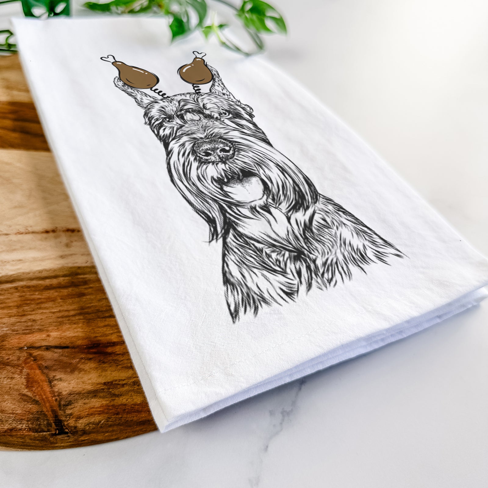 Hand-drawn sketch of Zuri the Giant Schnauzer with a Thanksgiving turkey headpiece on a tea towel