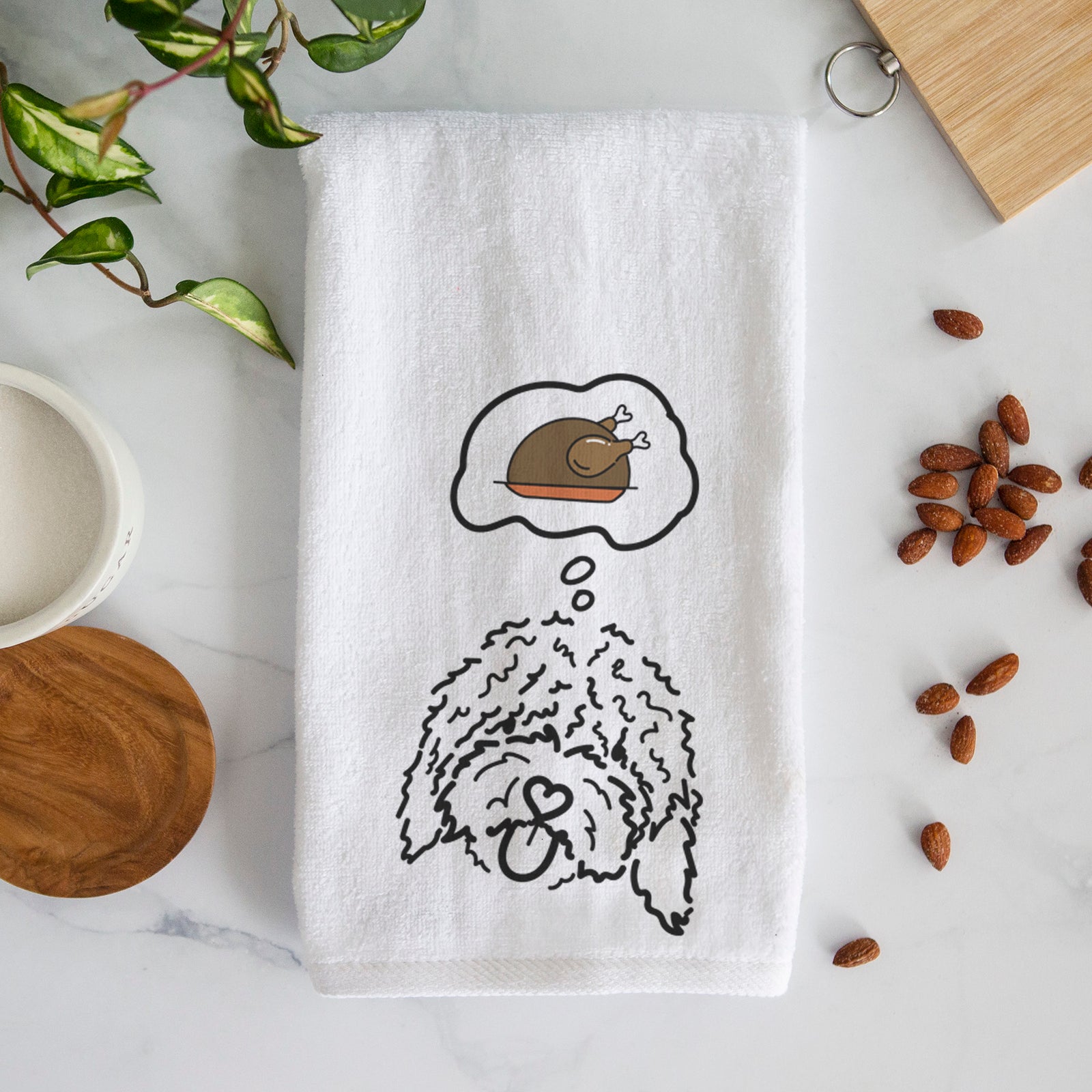 Minimalist line drawing of Antonio the Spanish Water Dog with a little turkey on a decorative hand towel