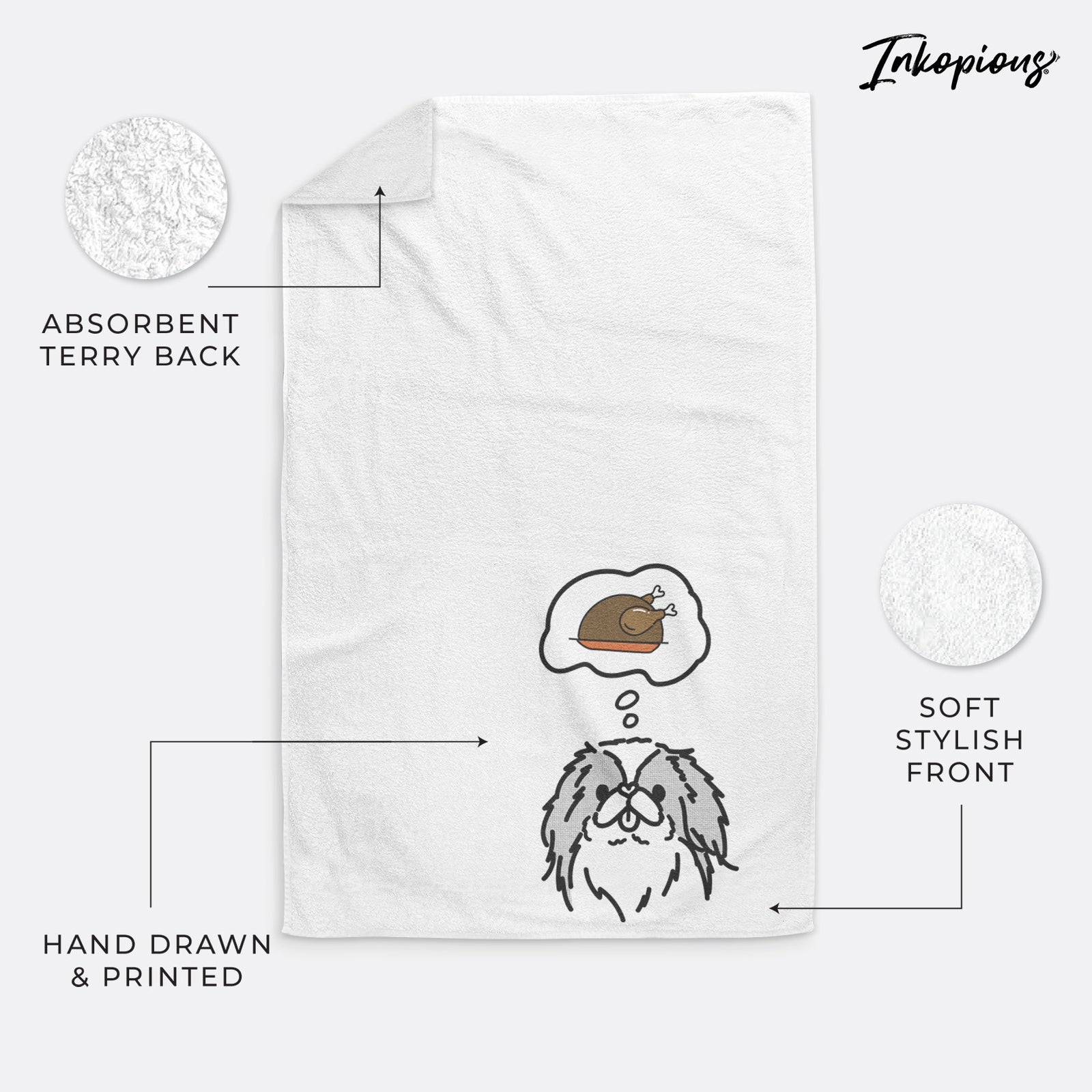 Minimalist line drawing of Macha the Japanese Chin with a little turkey on a decorative hand towel