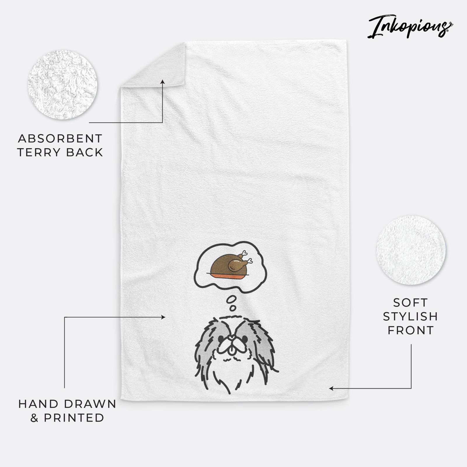 Minimalist line drawing of Macha the Japanese Chin with a little turkey on a decorative hand towel