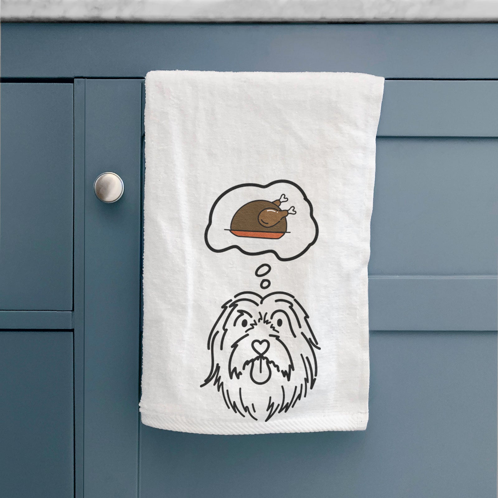 Minimalist line drawing of Tucker the Bearded Collie with a little turkey on a decorative hand towel