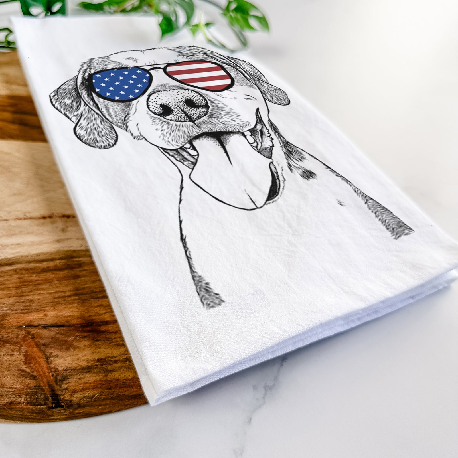 Hand-drawn sketch of Ace Boogie the Mixed Breed wearing American flag sunglasses on a tea towel