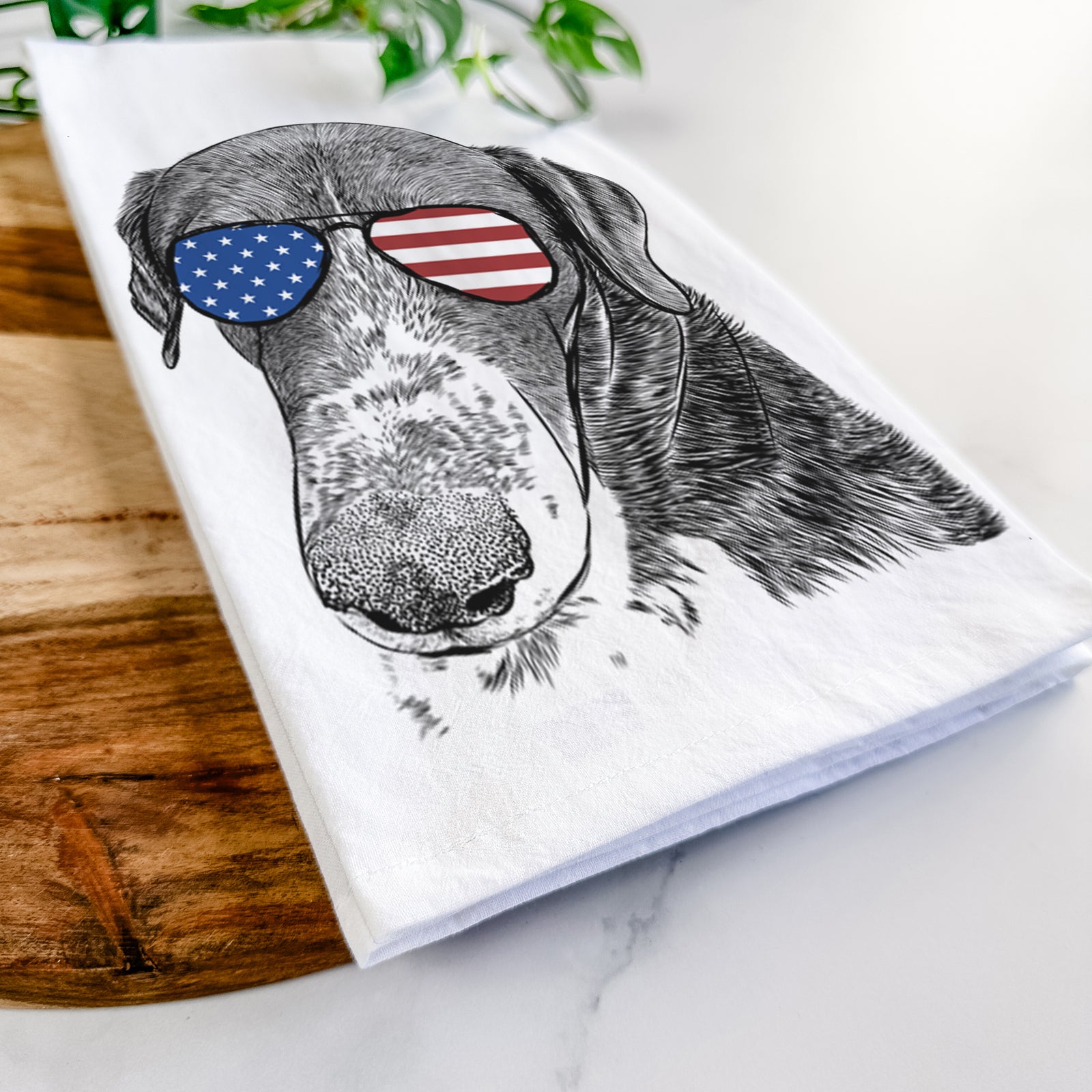 Hand-drawn sketch of Angel Orion the Mixed Breed wearing American flag sunglasses on a tea towel