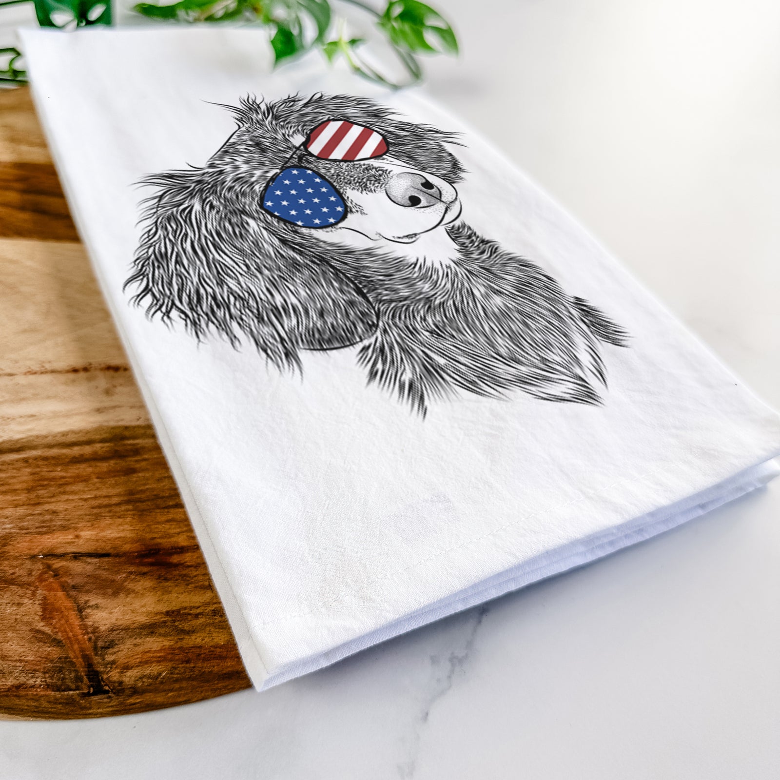 Hand-drawn sketch of Bailey the Long Haired Dachshund wearing American flag sunglasses on a tea towel