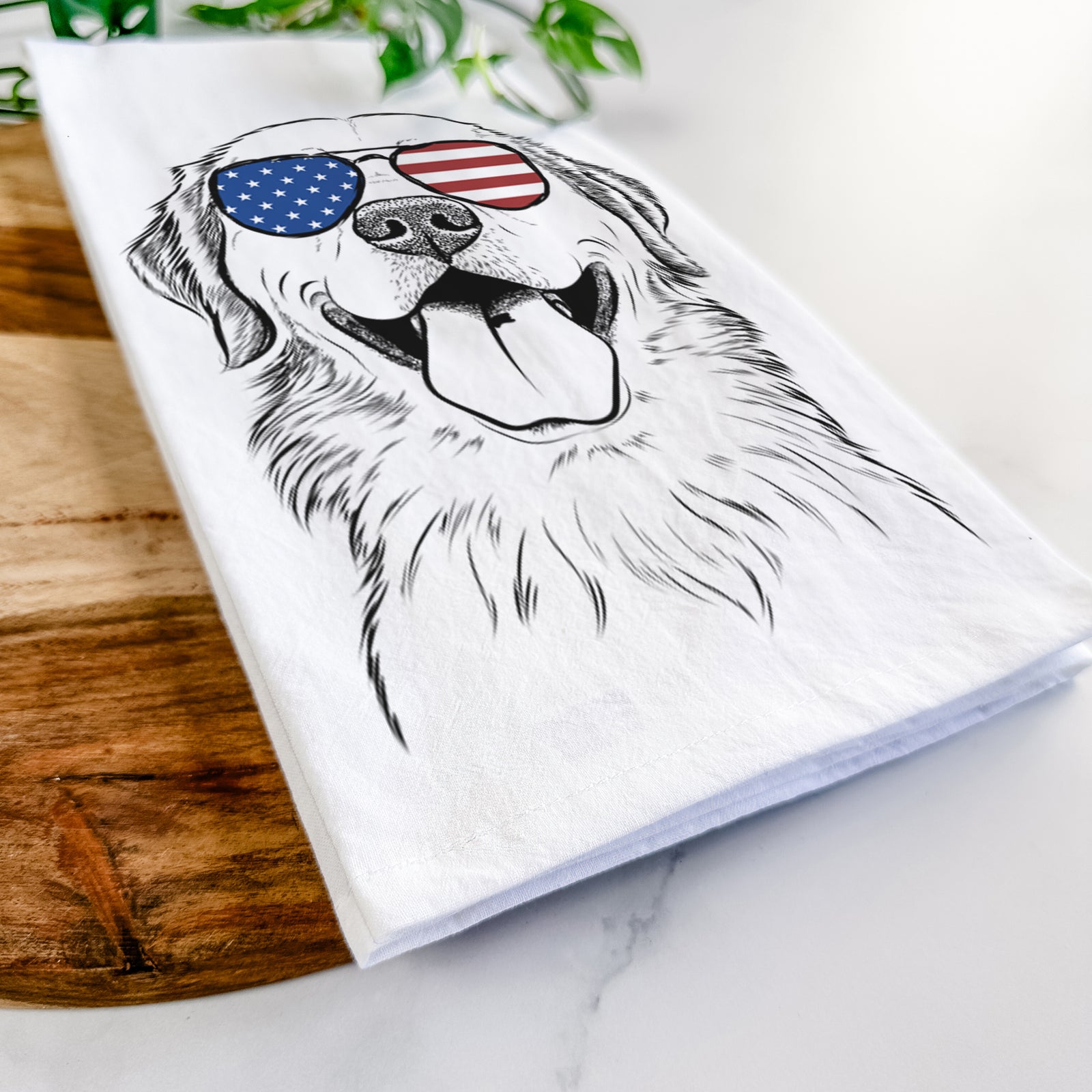 Hand-drawn sketch of Bennett the Golden Retriever wearing American flag sunglasses on a tea towel