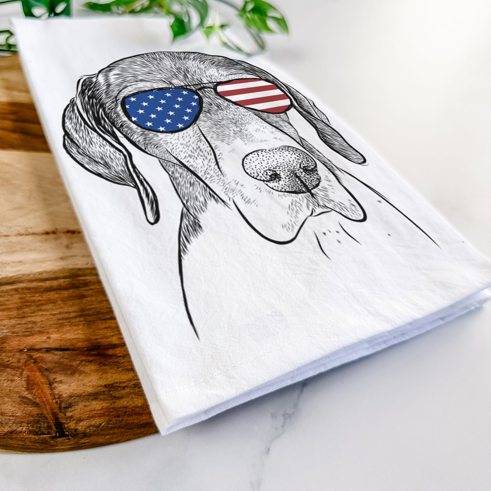 Hand-drawn sketch of Bohdi the German Shorthaired Pointer wearing American flag sunglasses on a tea towel