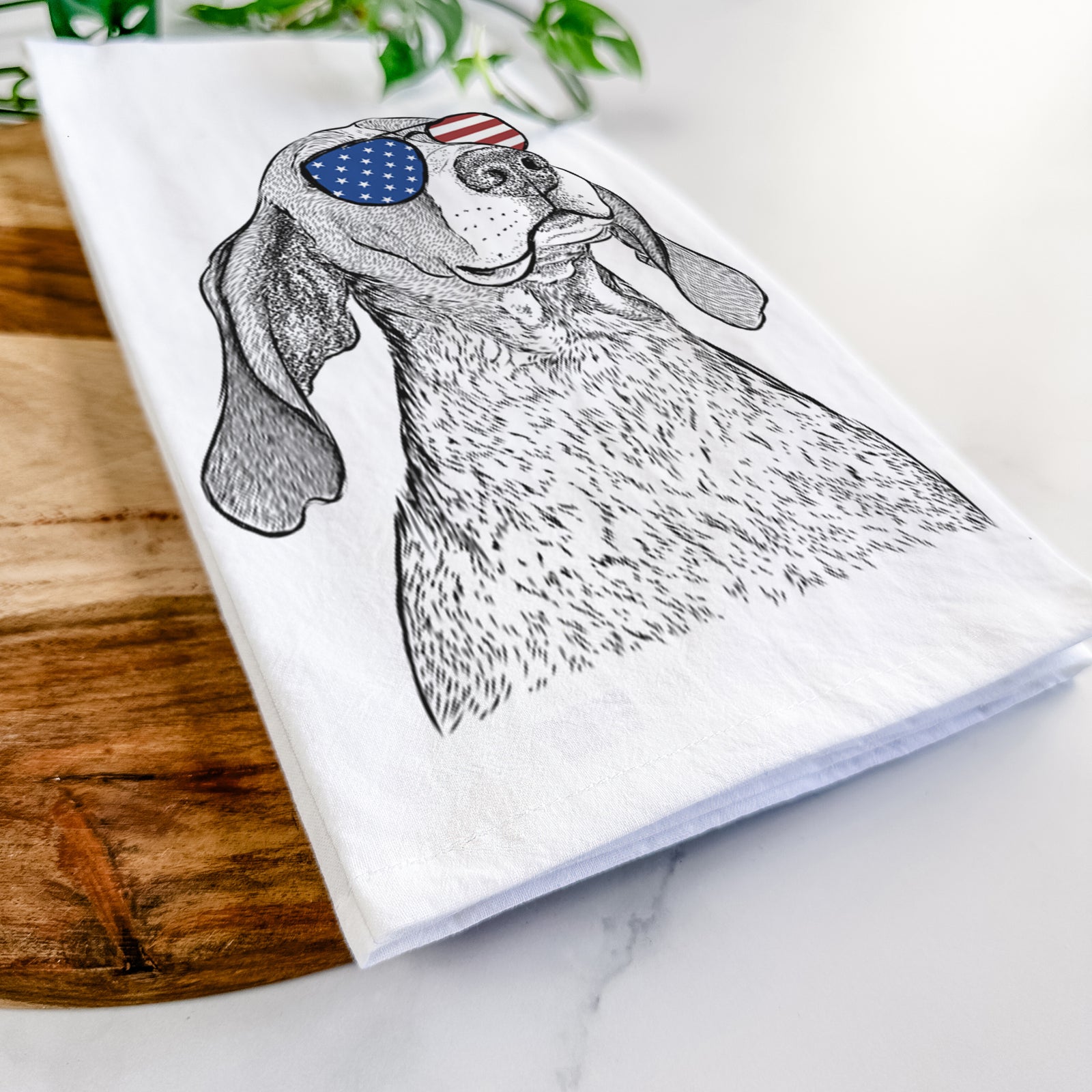 Hand-drawn sketch of Chester the Red Tick Coonhound wearing American flag sunglasses on a tea towel