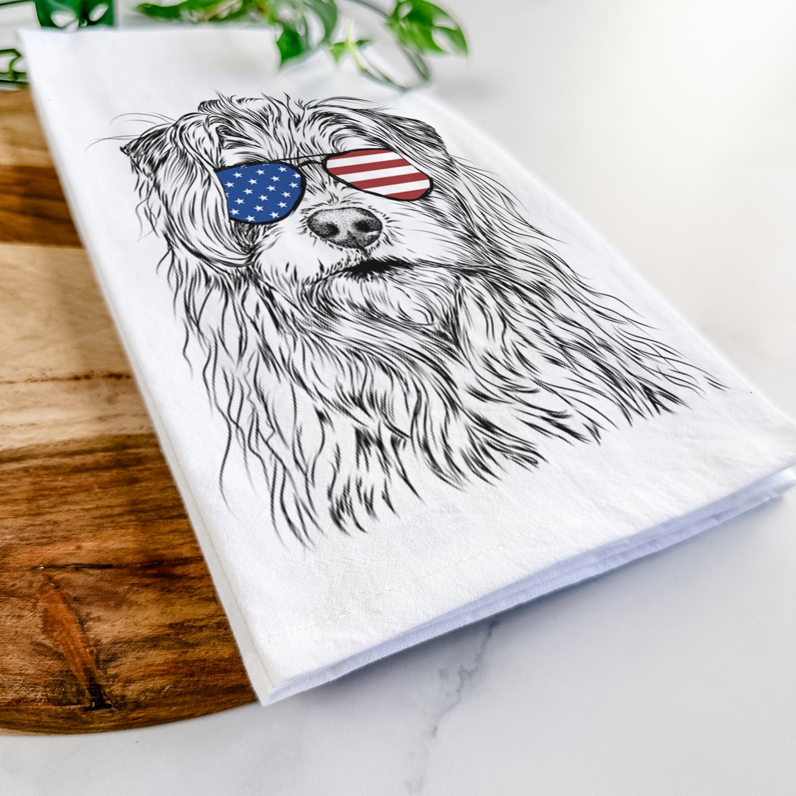 Hand-drawn sketch of Chester the Terrier Mix wearing American flag sunglasses on a tea towel