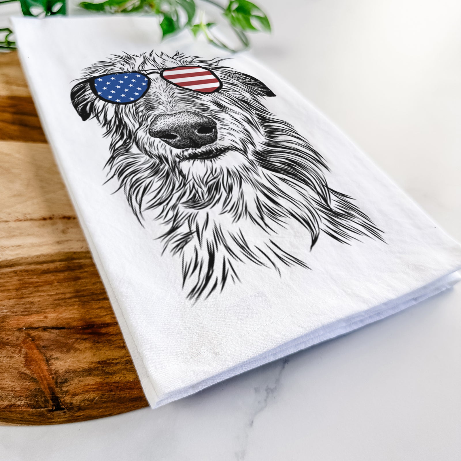 Hand-drawn sketch of Cleod the Scottish Deerhound wearing American flag sunglasses on a tea towel