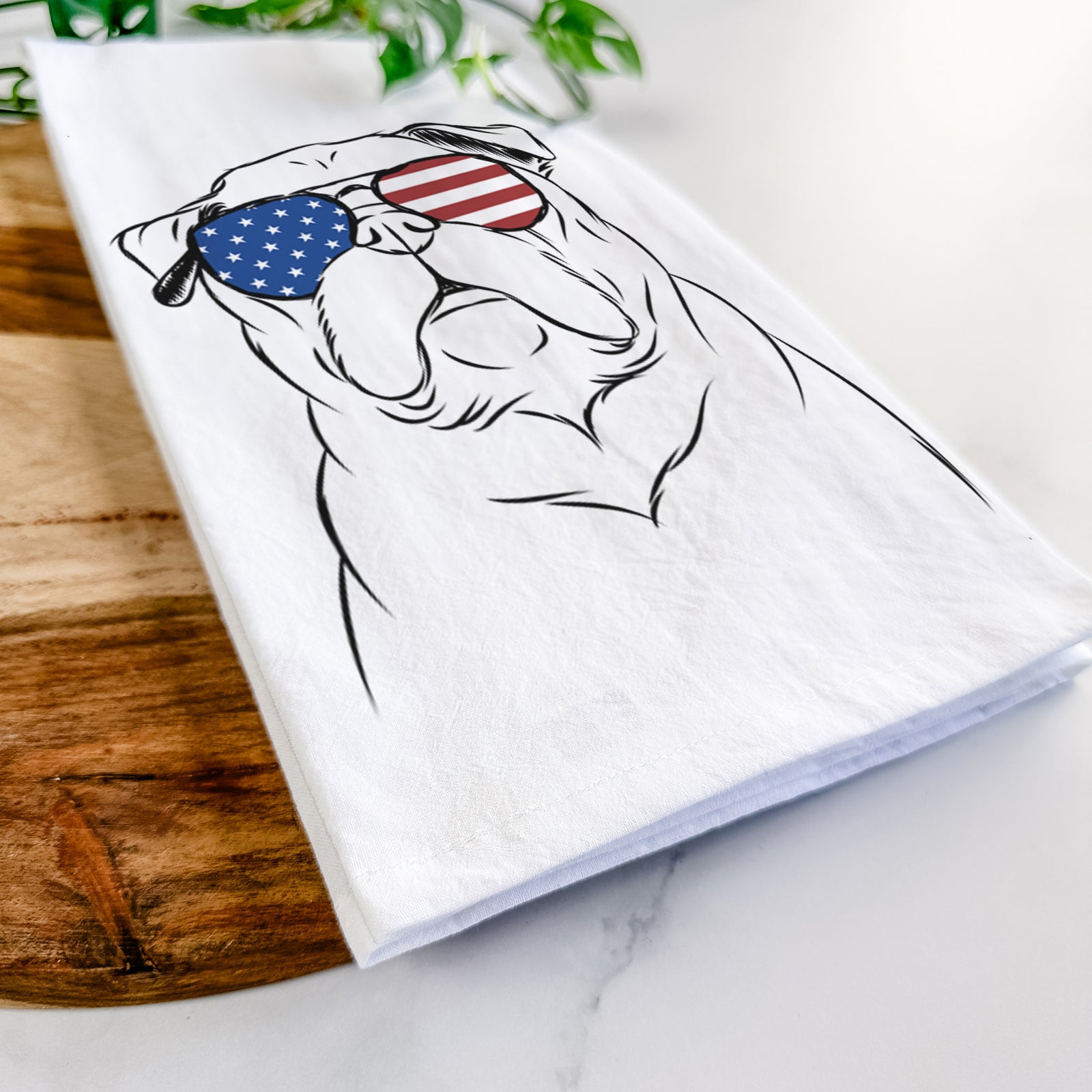 Hand-drawn sketch of Darling Chloe the Pug wearing American flag sunglasses on a tea towel