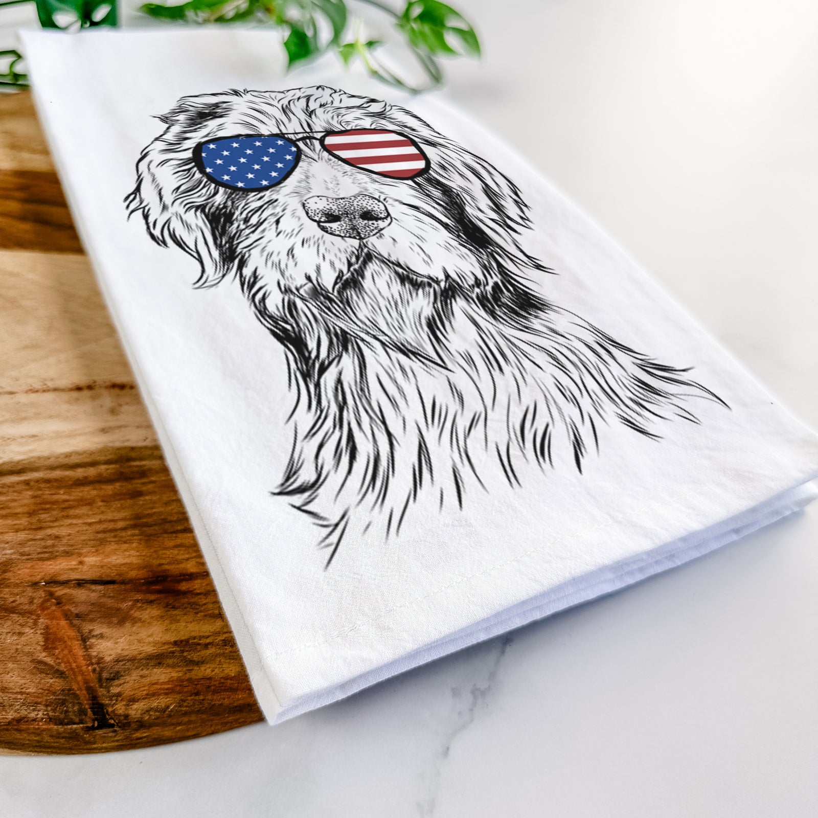 Hand-drawn sketch of Doc Holliday the Pudelpointer wearing American flag sunglasses on a tea towel