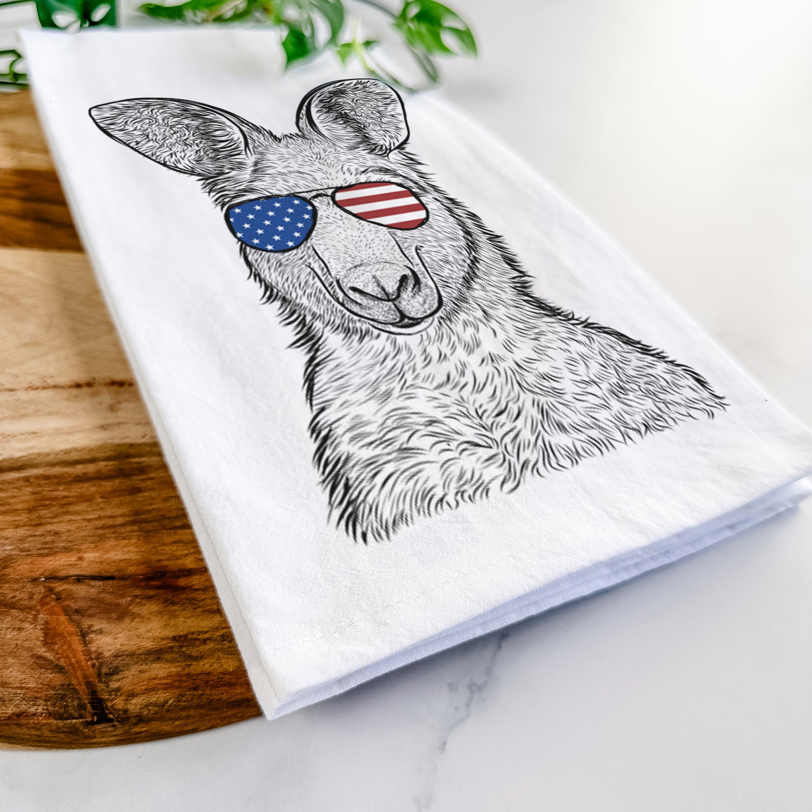 Hand-drawn sketch of Evelyn the Eastern Grey Kangaroo wearing American flag sunglasses on a tea towel