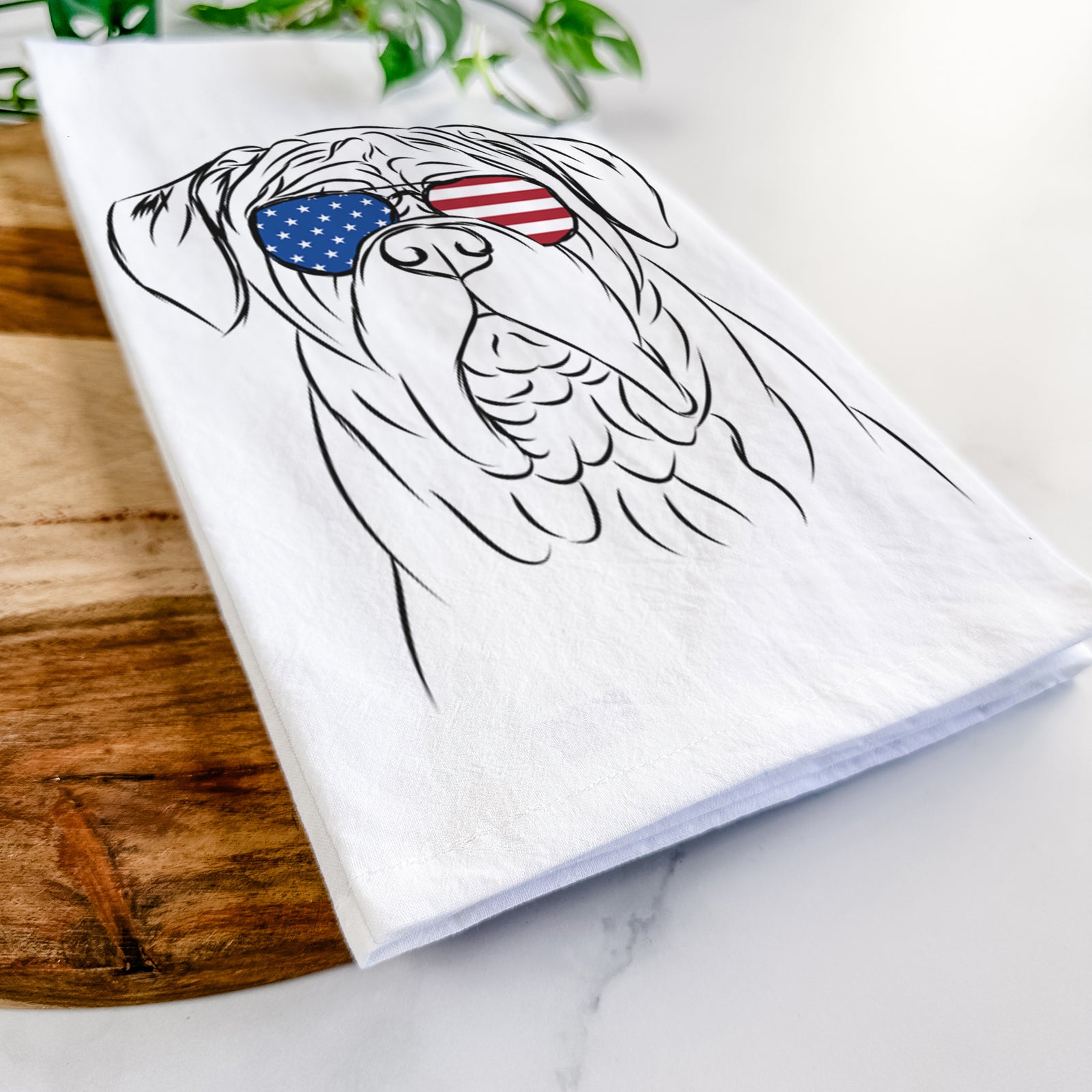 Hand-drawn sketch of Felix the Dogue de Bordeaux wearing American flag sunglasses on a tea towel