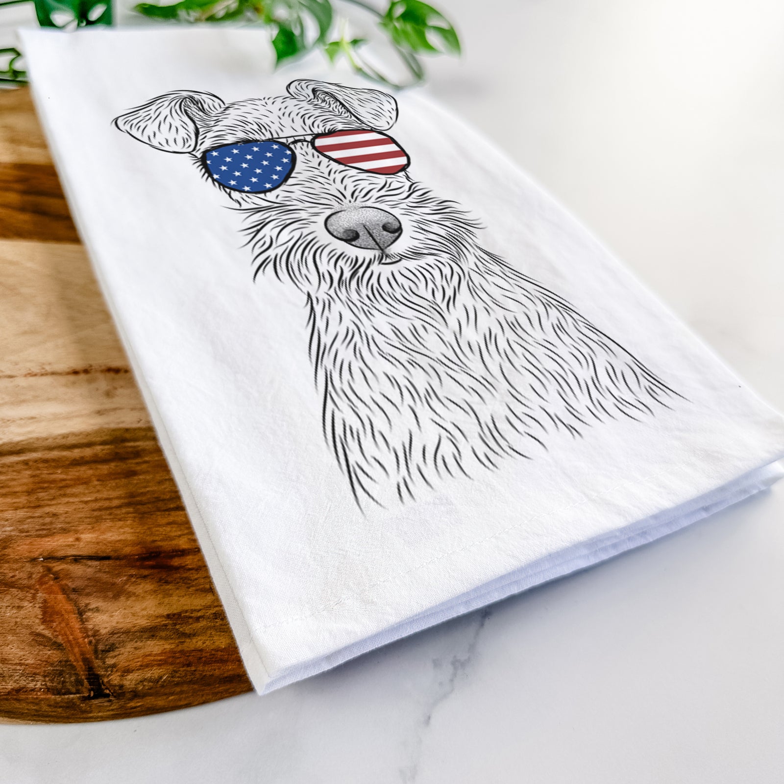 Hand-drawn sketch of Fitz the Wire Fox Terrier wearing American flag sunglasses on a tea towel