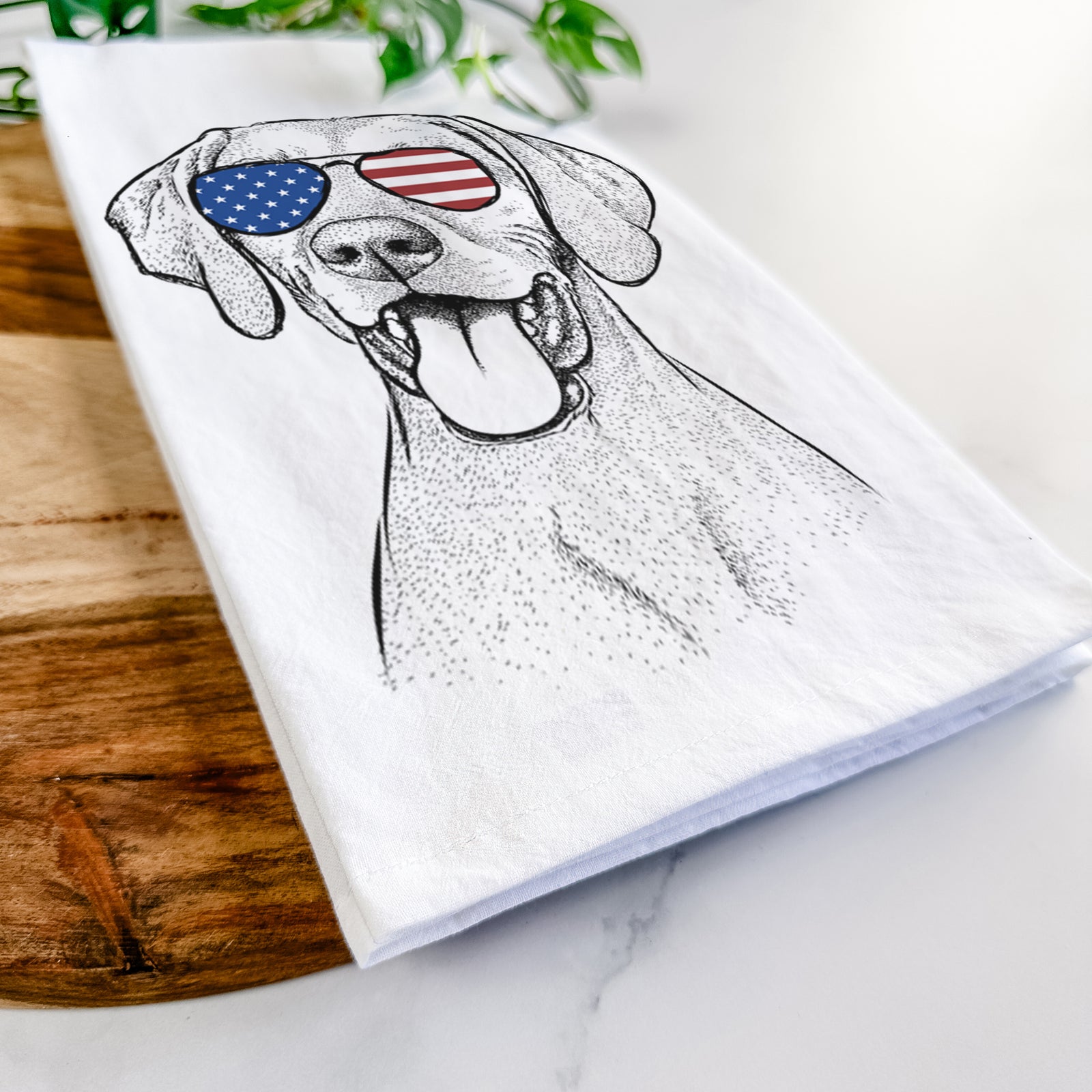 Hand-drawn sketch of Harper the Vizsla wearing American flag sunglasses on a tea towel