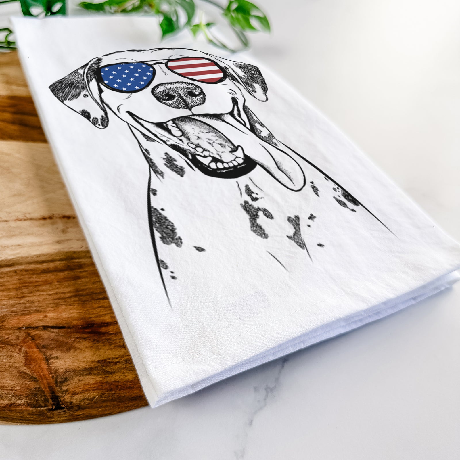 Hand-drawn sketch of Hydro the Dalmatian wearing American flag sunglasses on a tea towel