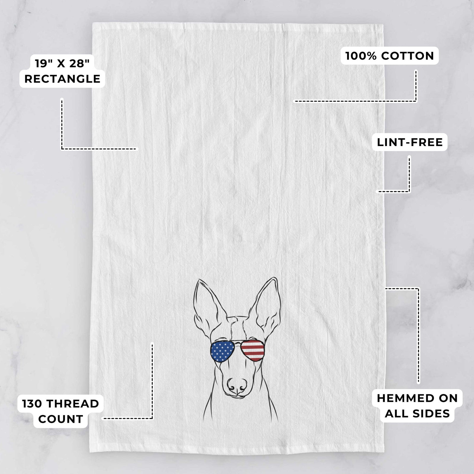 Hand-drawn sketch of Indy the Ibizan Hound wearing American flag sunglasses on a tea towel, with feature callouts: 19 x 28 inch rectangle, 100% cotton, lint-free, 120 thread count, hemmed on all sides