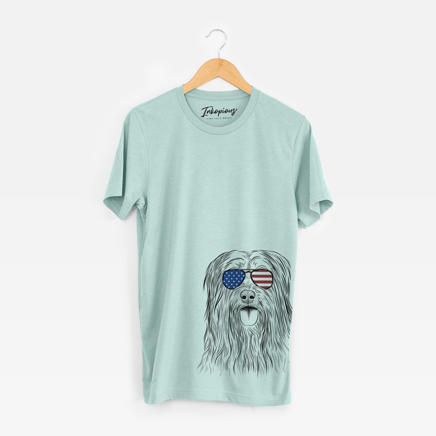 Hand-drawn sketch of Indy the Korean Sapsali wearing American flag sunglasses on a Heather Sage Unisex crewneck