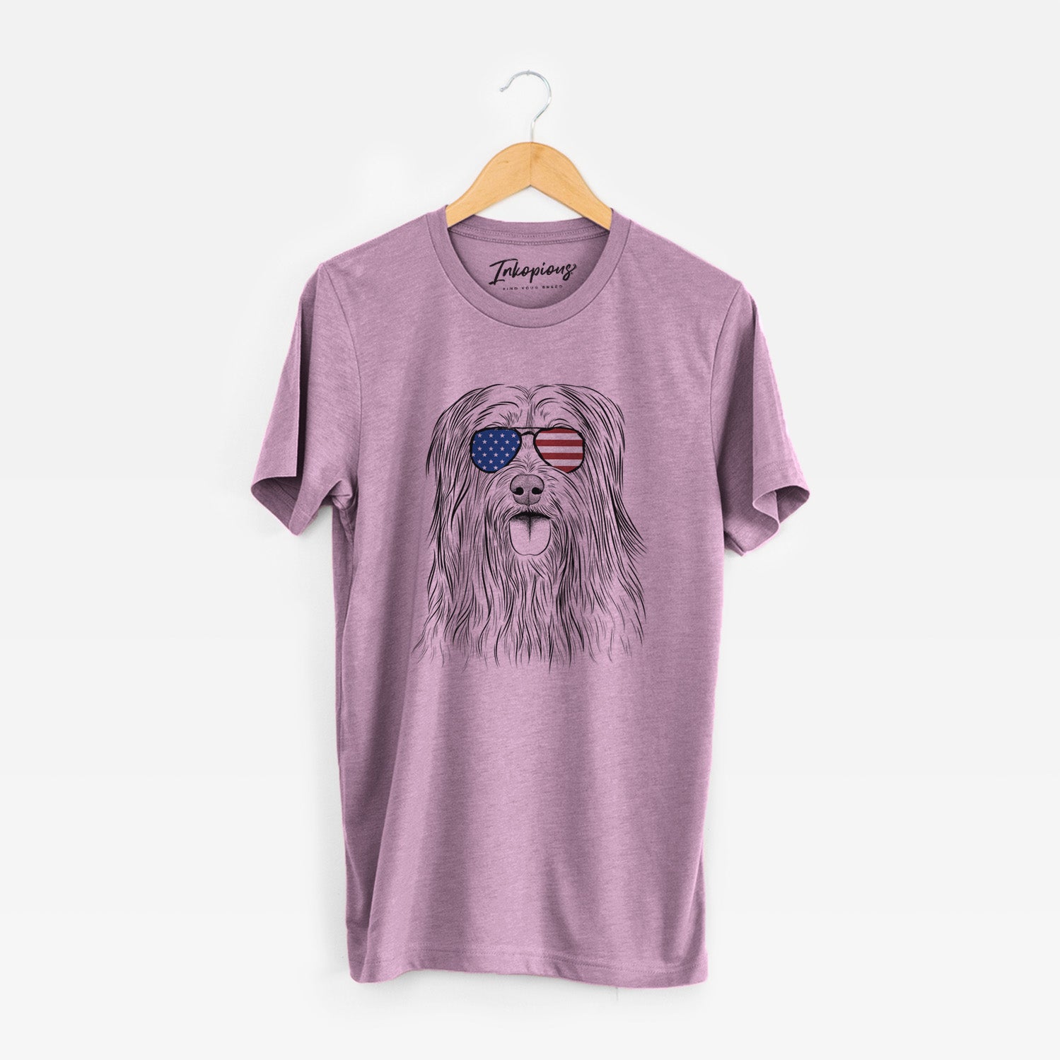 Hand-drawn sketch of Indy the Korean Sapsali wearing American flag sunglasses on an Orchid Unisex crewneck