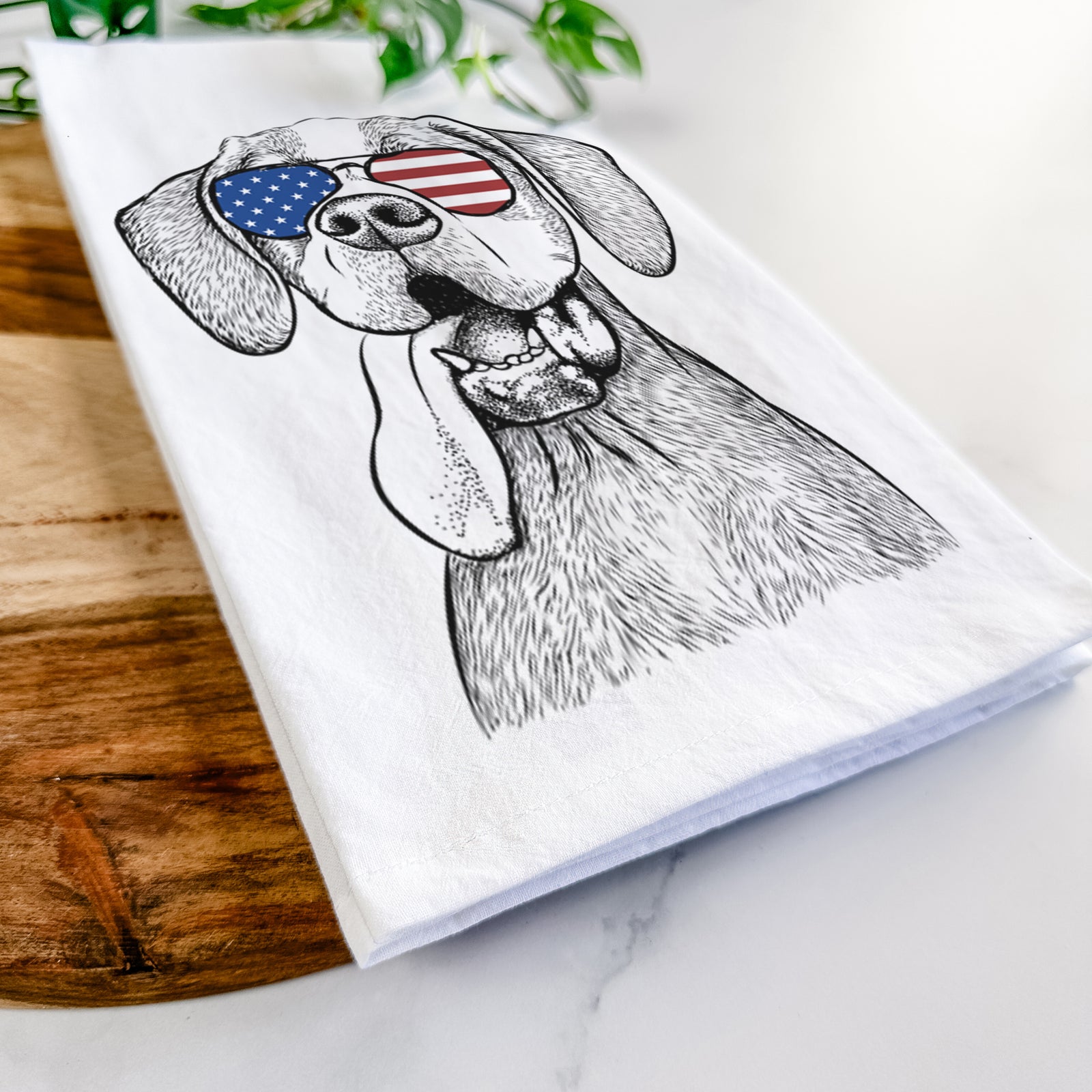 Hand-drawn sketch of Irwin the English Pointer wearing American flag sunglasses on a tea towel