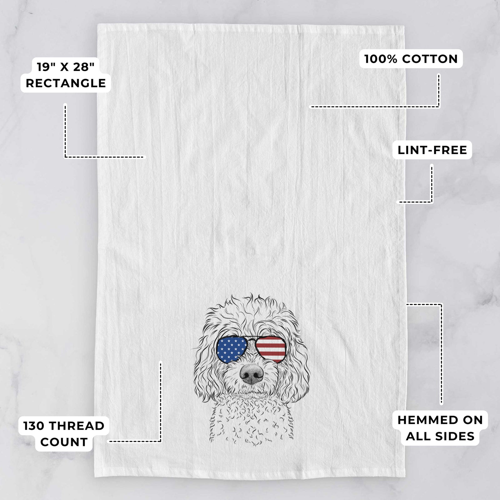 Hand-drawn sketch of Izzie the Cavachon wearing American flag sunglasses on a tea towel, with feature callouts: 19 x 28 inch rectangle, 100% cotton, lint-free, 120 thread count, hemmed on all sides