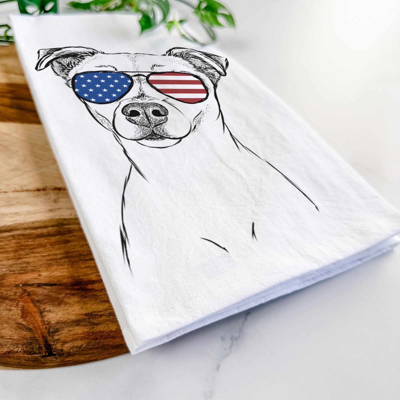 Hand-drawn sketch of Izzy the Chiweenie wearing American flag sunglasses on a tea towel