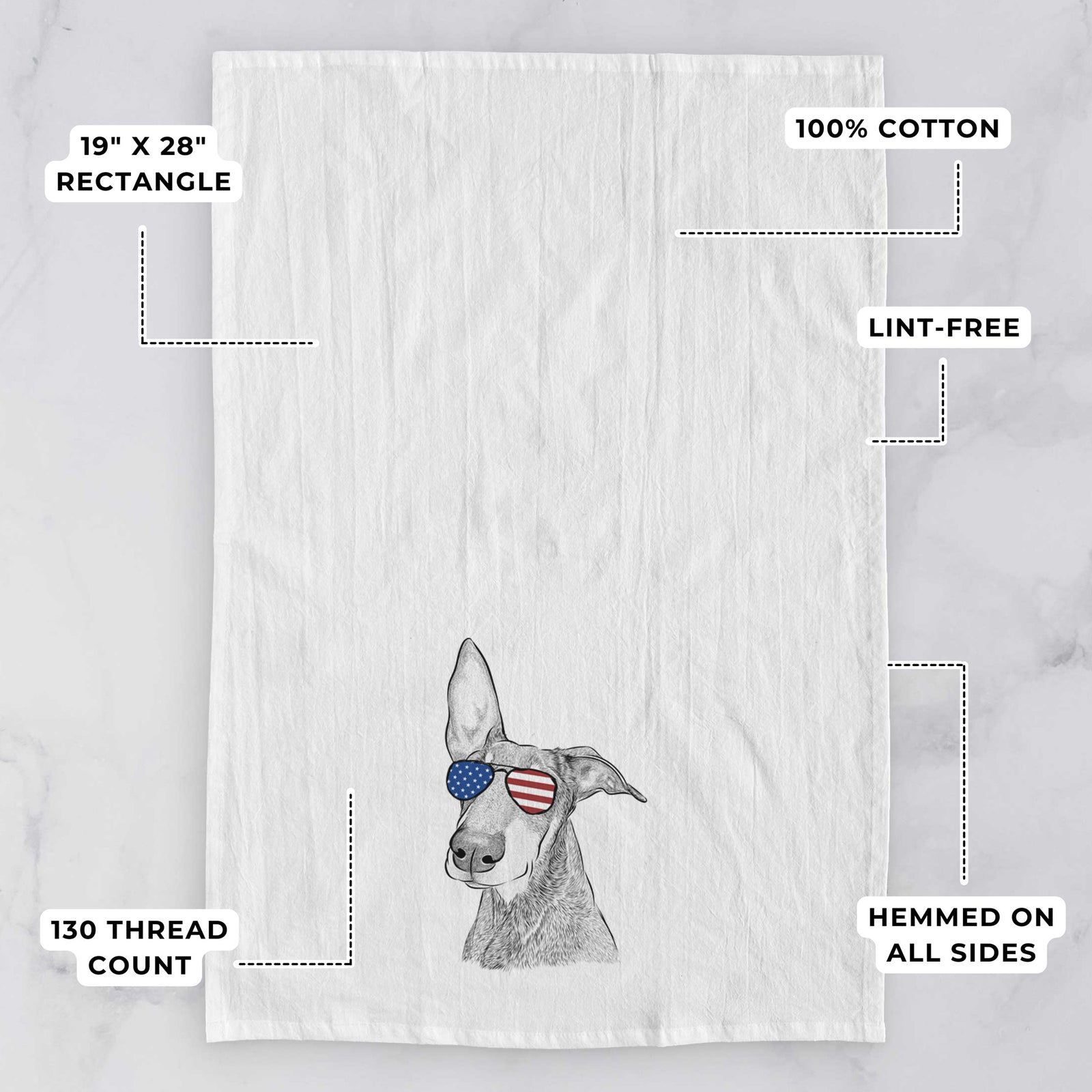Hand-drawn sketch of Kain the Doberman Pinscher wearing American flag sunglasses on a tea towel, with feature callouts: 19 x 28 inch rectangle, 100% cotton, lint-free, 120 thread count, hemmed on all sides