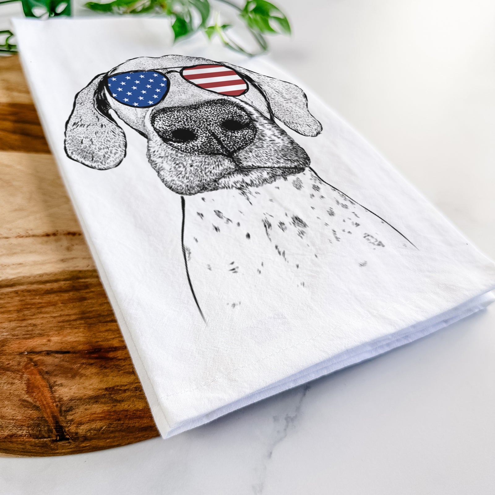 Hand-drawn sketch of Leroy the German Shorthaired Pointer wearing American flag sunglasses on a tea towel