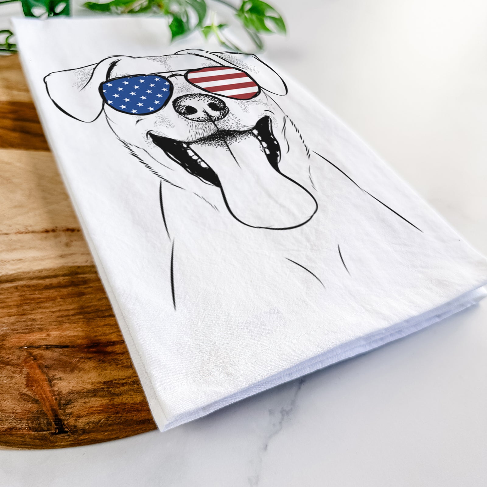 Hand-drawn sketch of Lily Estelle the Mixed Breed wearing American flag sunglasses on a tea towel