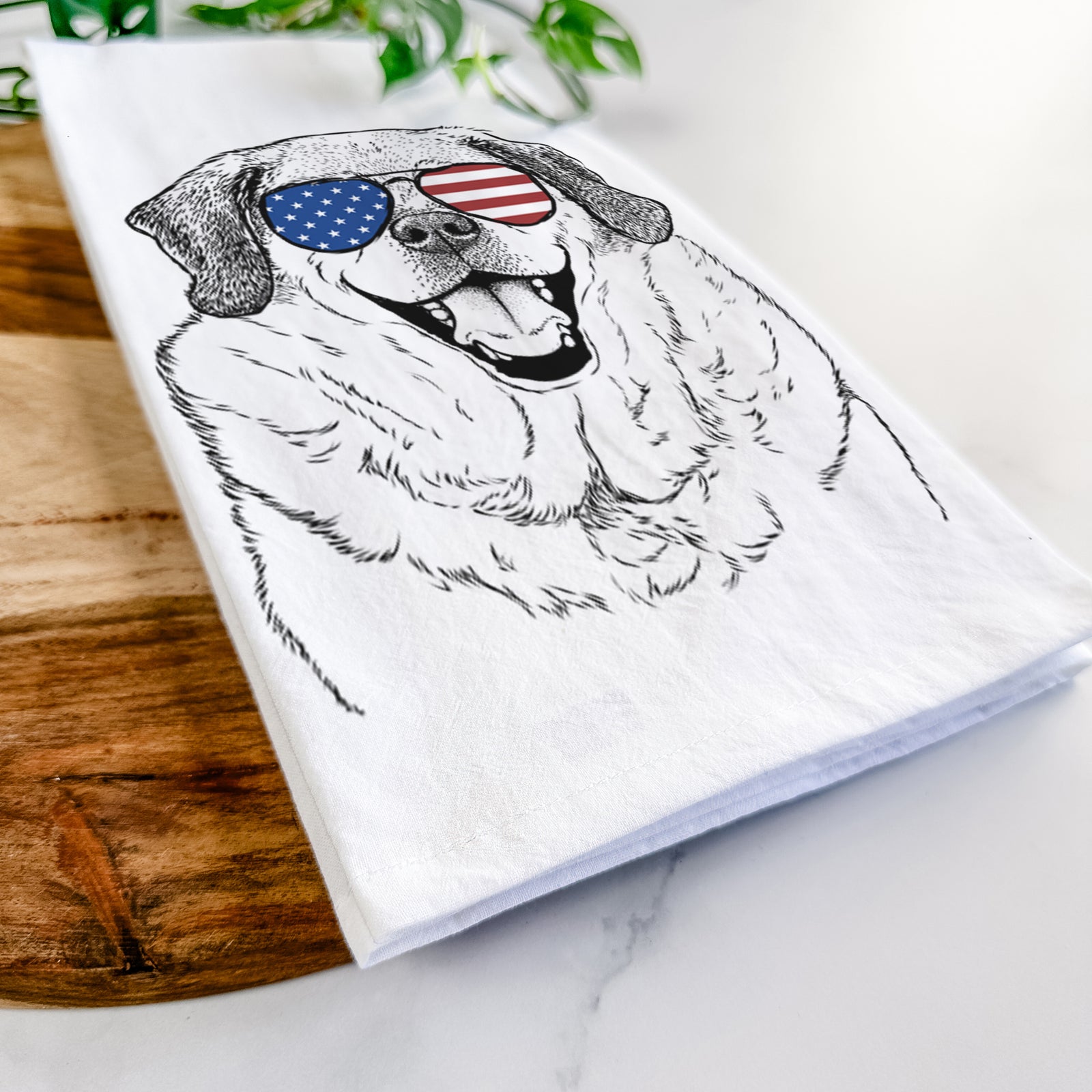 Hand-drawn sketch of Little Man the Puggle wearing American flag sunglasses on a tea towel