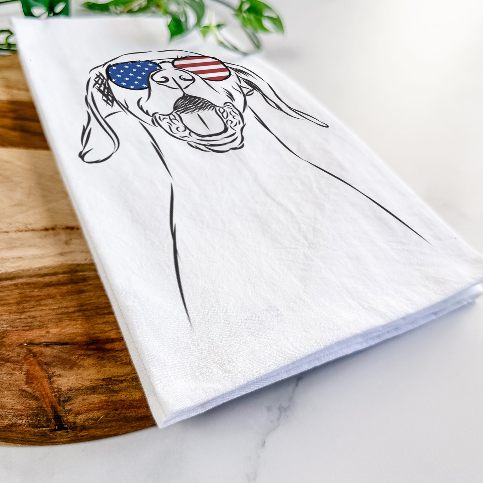 Hand-drawn sketch of Ollie the Vizsla wearing American flag sunglasses on a tea towel