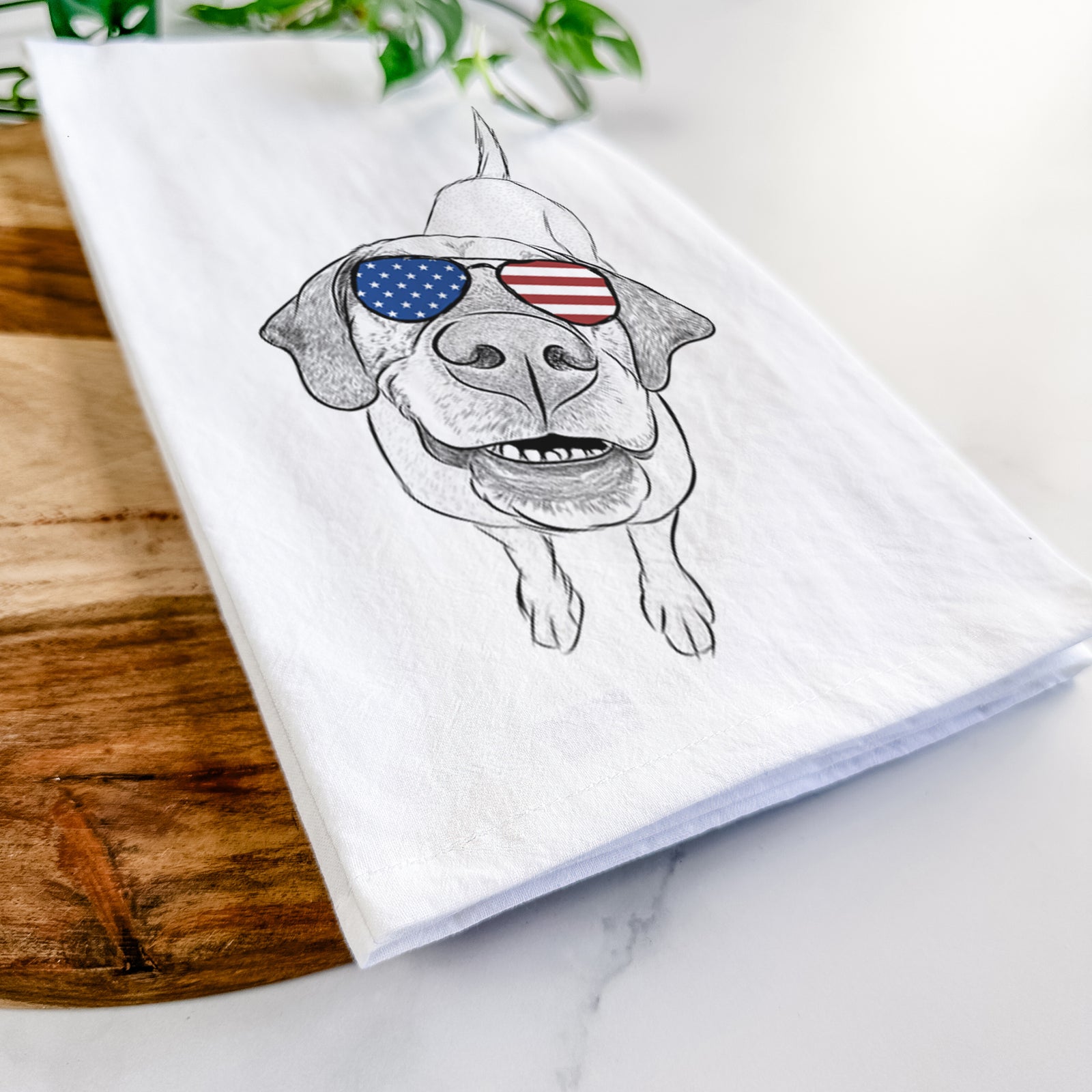 Hand-drawn sketch of Oquirrh the Vizsla wearing American flag sunglasses on a tea towel