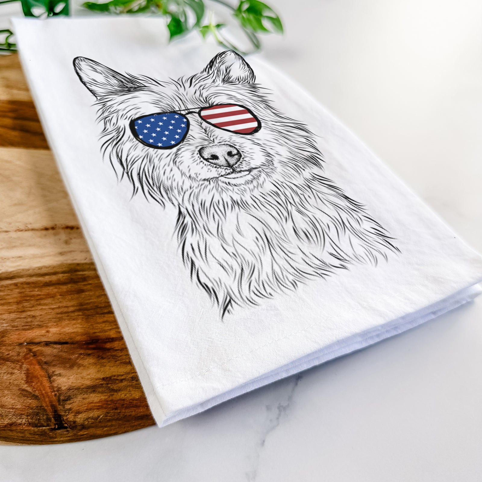 Hand-drawn sketch of Paulo the Portuguese Podengo wearing American flag sunglasses on a tea towel