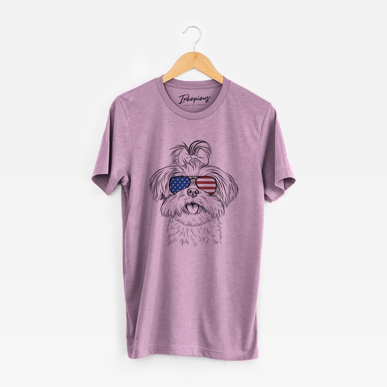 Hand-drawn sketch of Pebbles the Shorkie wearing American flag sunglasses on an Orchid Unisex crewneck