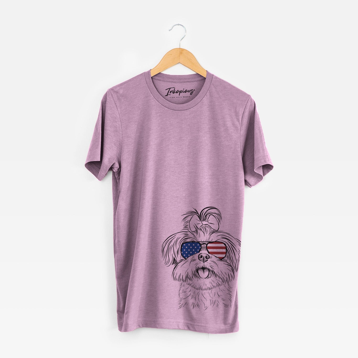 Hand-drawn sketch of Pebbles the Shorkie wearing American flag sunglasses on an Orchid Unisex crewneck